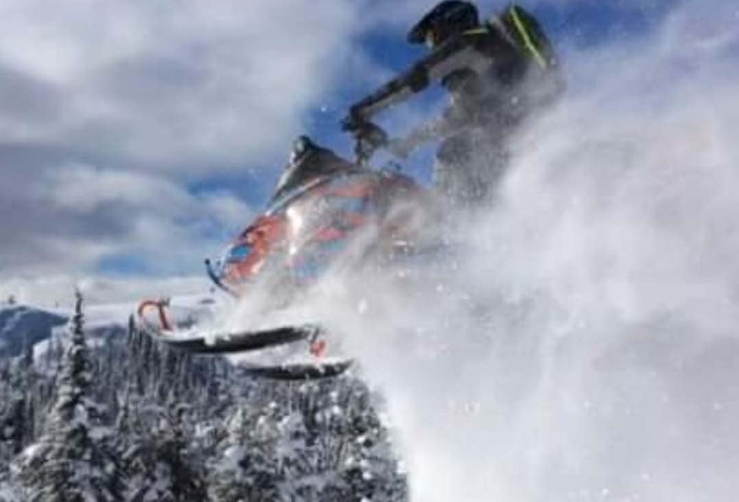 curtis ferney idaho wyoming broker associate jump on snowmobile