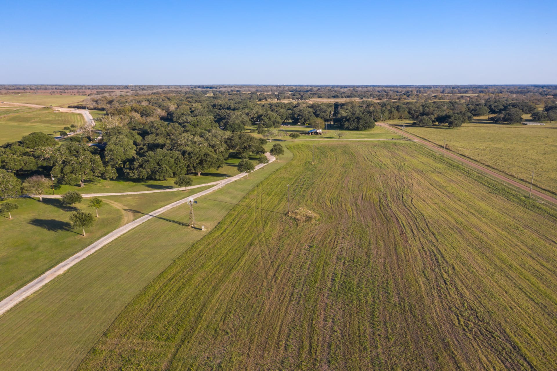 aerial of oaks and hay pasture texas 4lj3 ranch