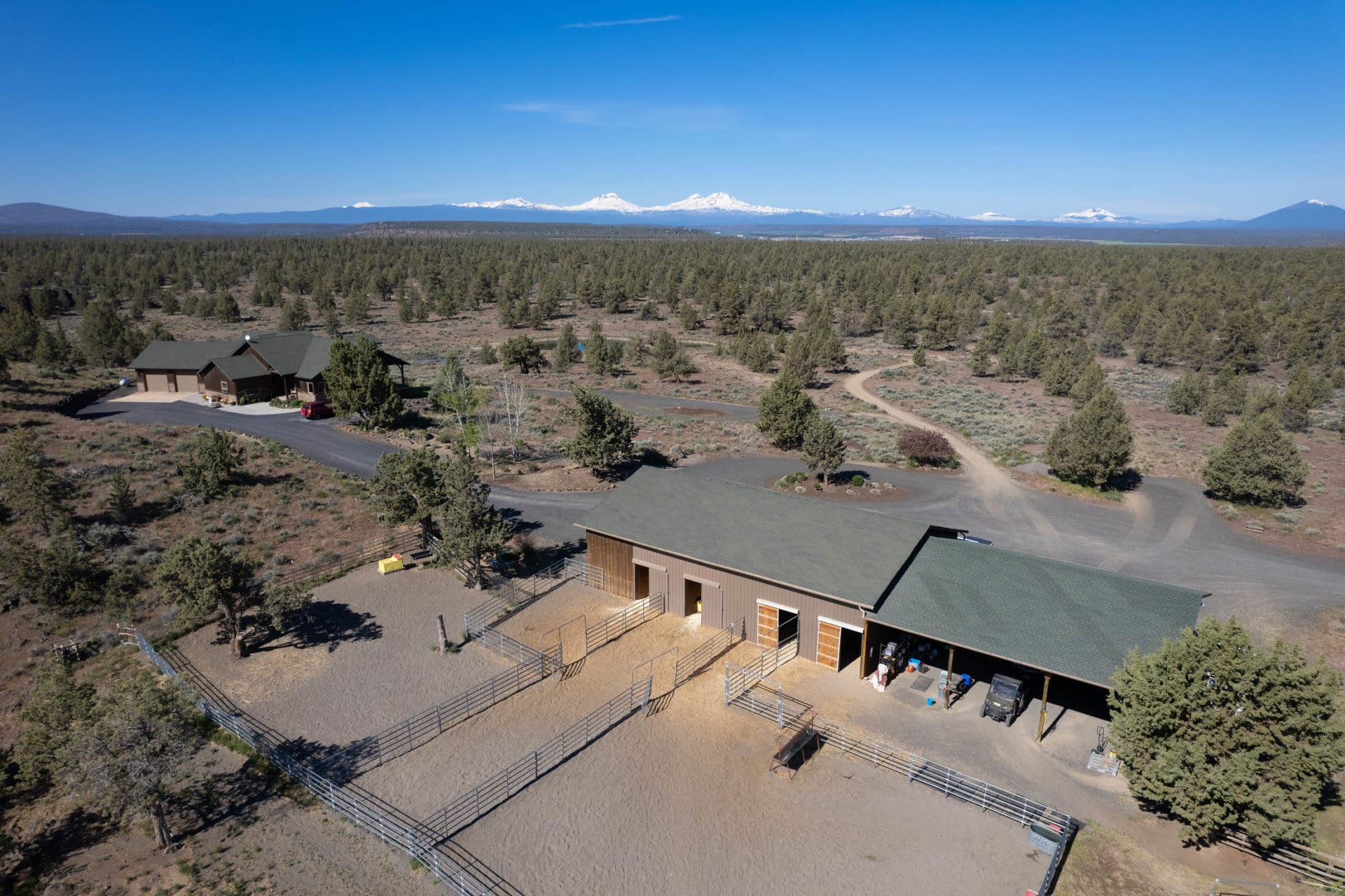 aerial of horse facility with residence in back oregon terrebonne equestrian estate