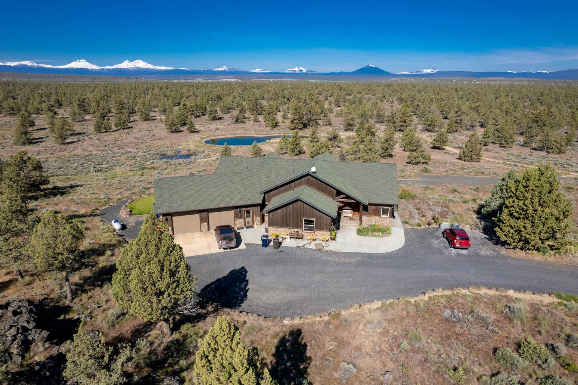 aerial residence with mountains landscaped across back oregon terrebonne equestrian estate
