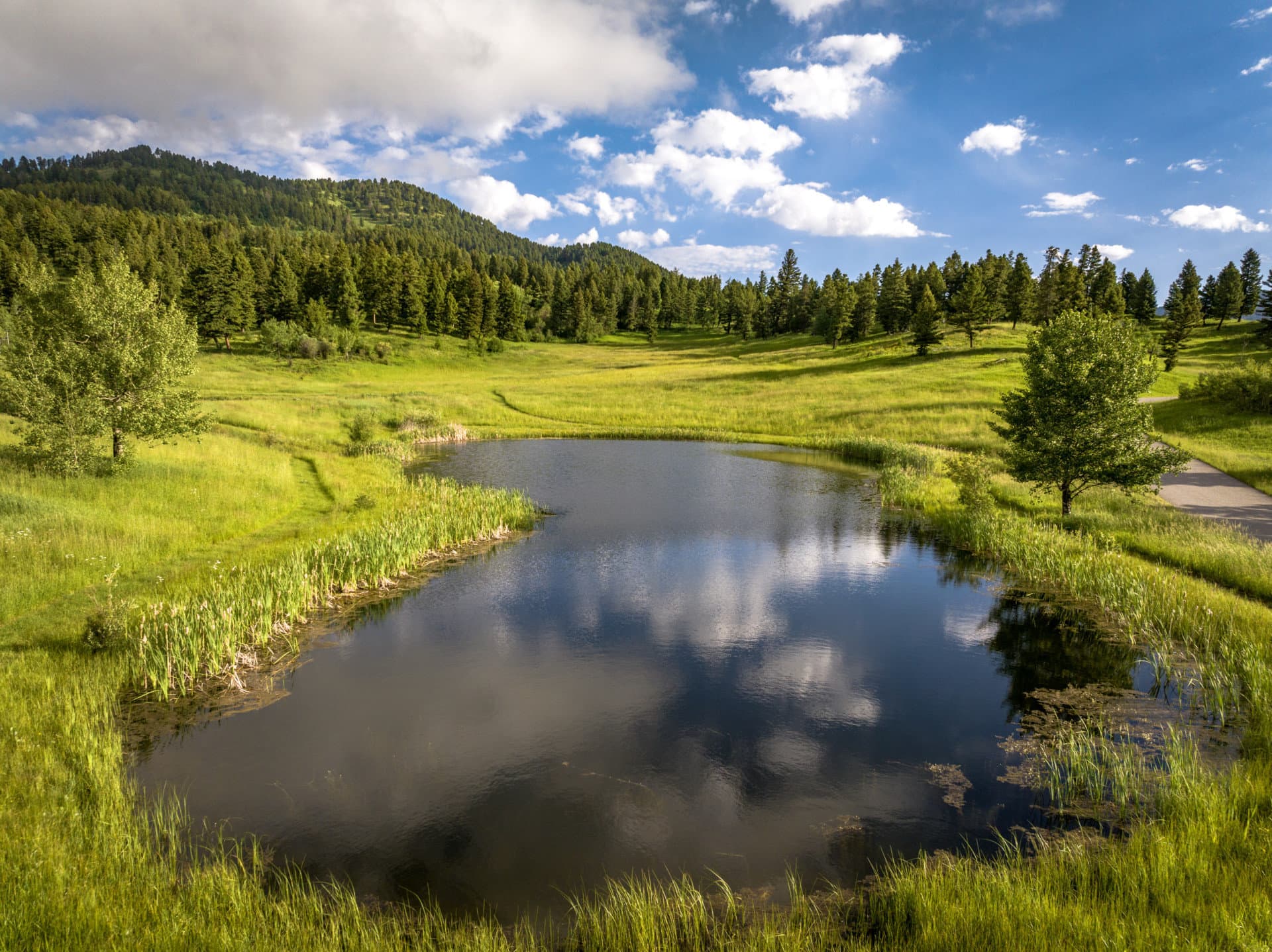 pond blue sky montana north pass ranches