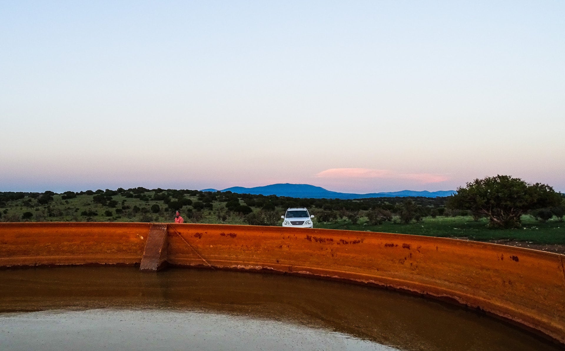 Watertank red sunset Mountain Socorro Cnty New Mexico The Eason Ranch