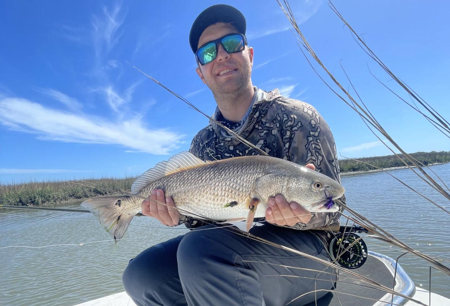 cooper lammonds sc real estate agent fishing on a boat