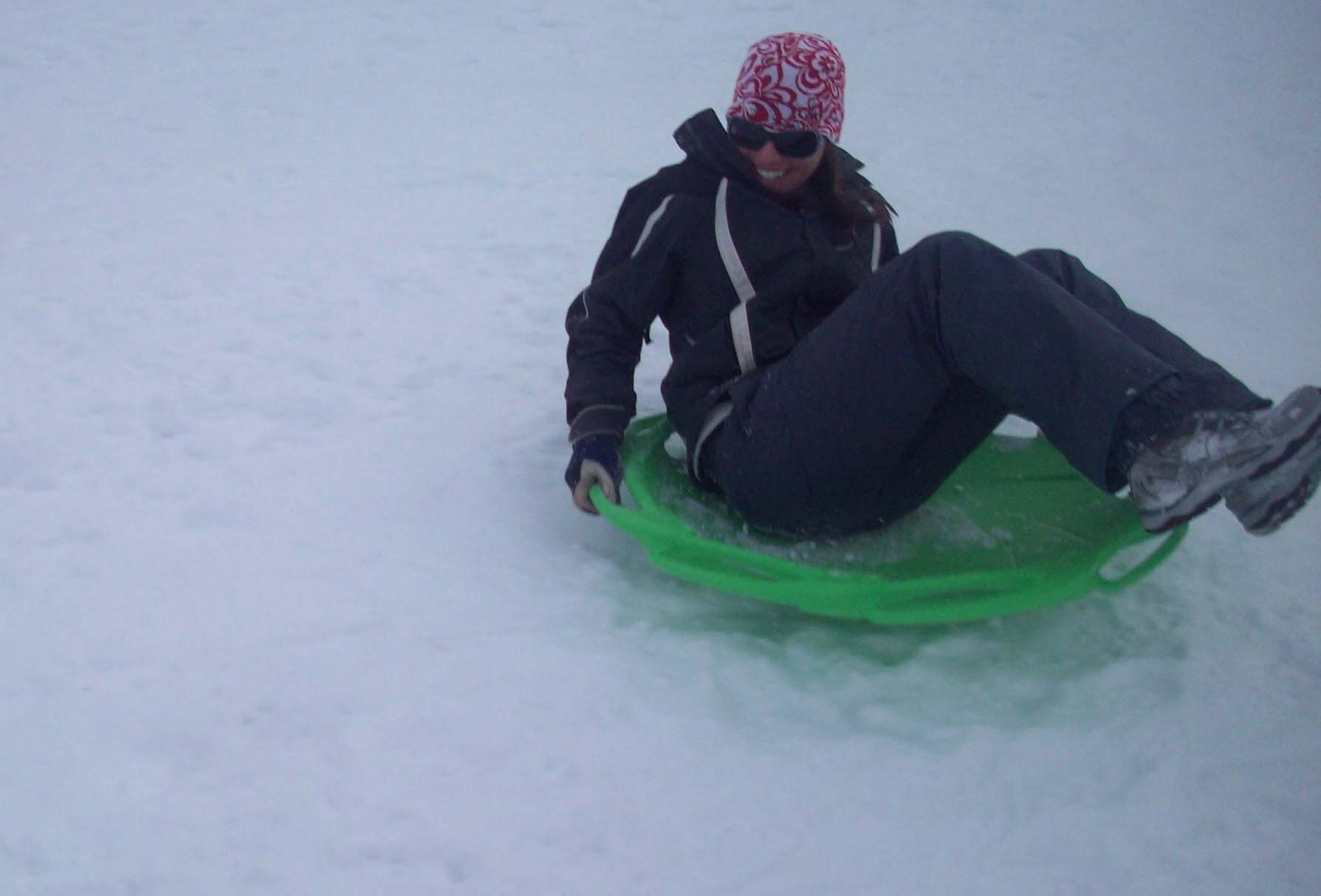 Naomi Alm licensed montana real estate broker sledding