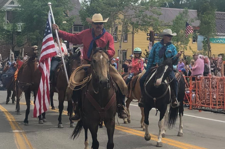 robb nelson wyoming broker flag parade