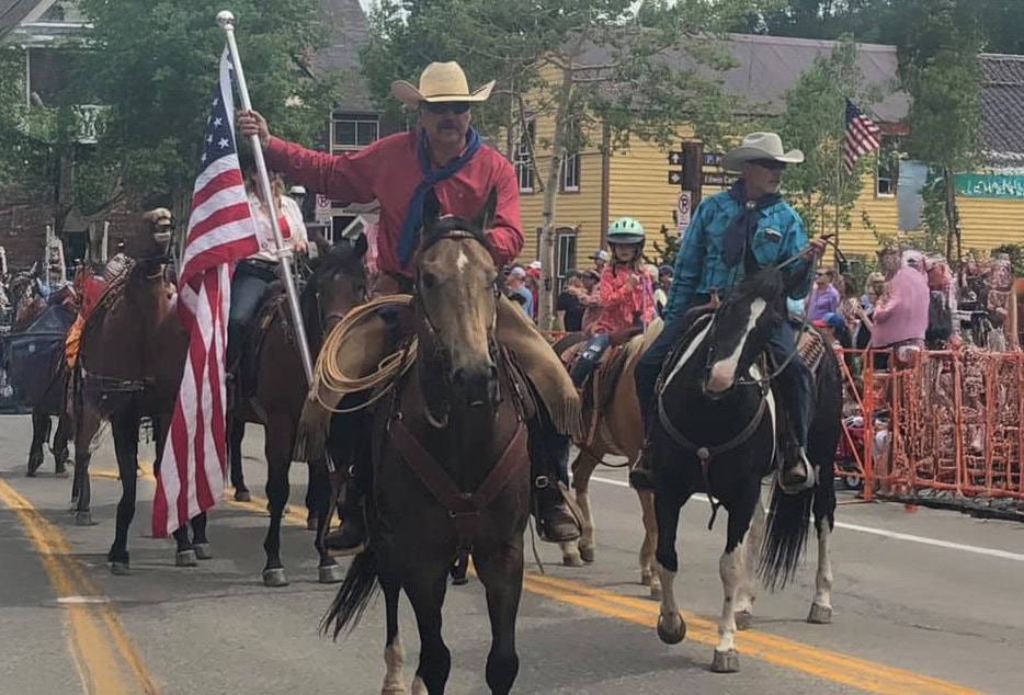 robb nelson wyoming broker flag parade