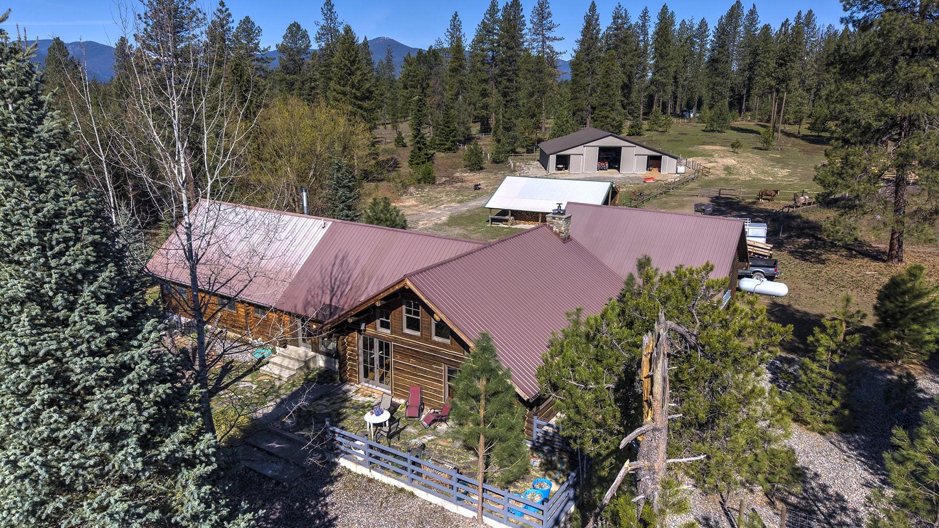 aerial log home shop building montana cabinet mountain wilderness retreat