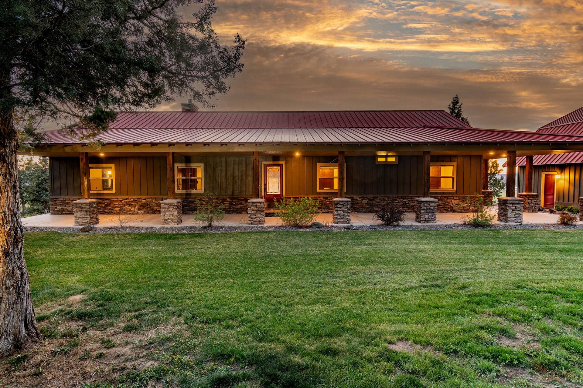 exterior ranch home with red roof and sunset oregon crooked river rim horse ranch