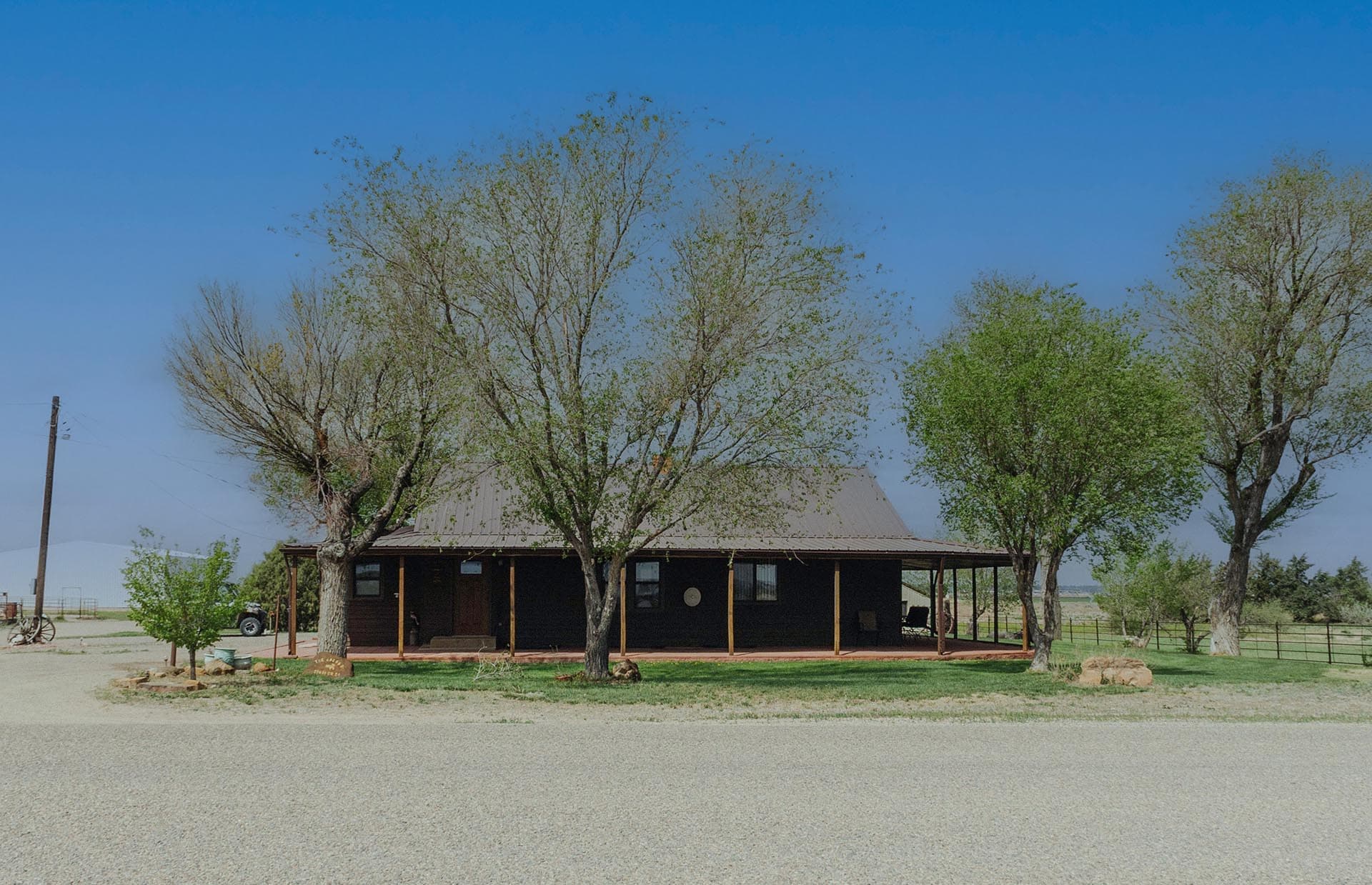 farm house with wraparound porch Colorado South Swink Farm Grow Yard