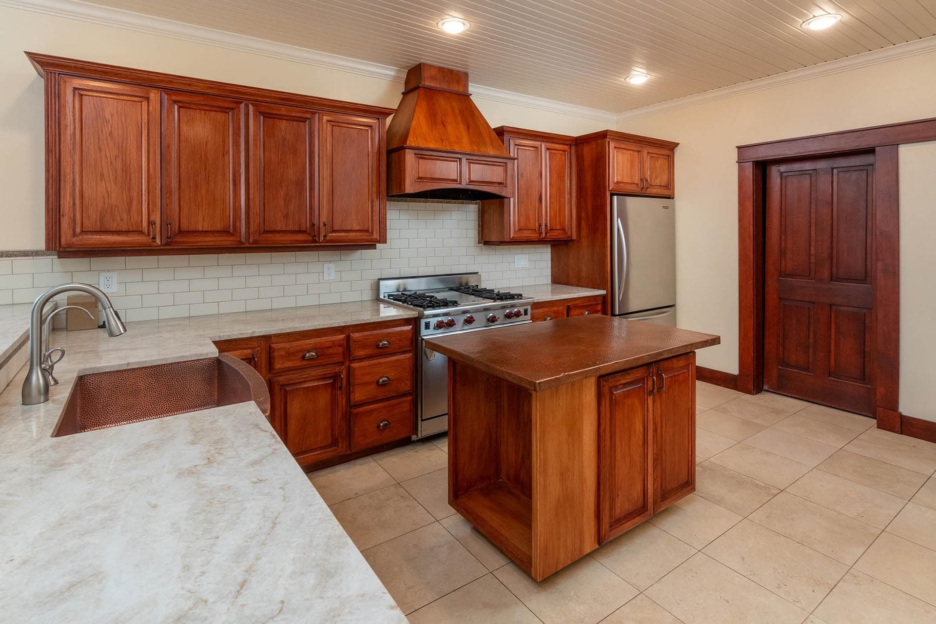 high end kitchen with island and custom wood cabinetry oregon crooked river rim horse ranch