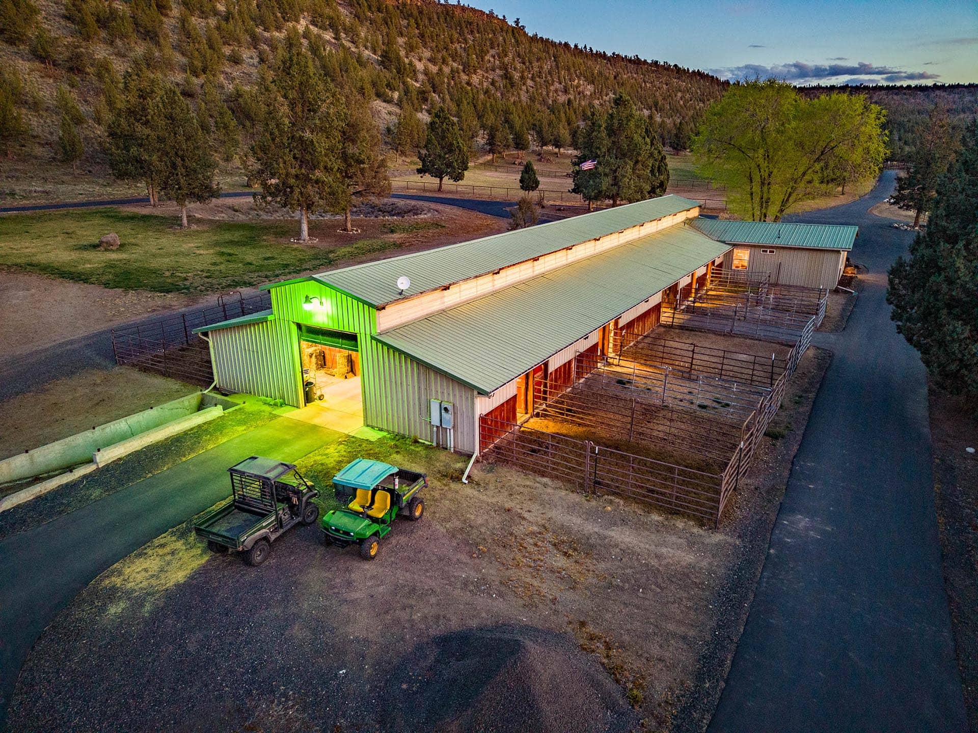 horse barn with stalls and paddocks at sunset oregon crooked river rim horse ranch