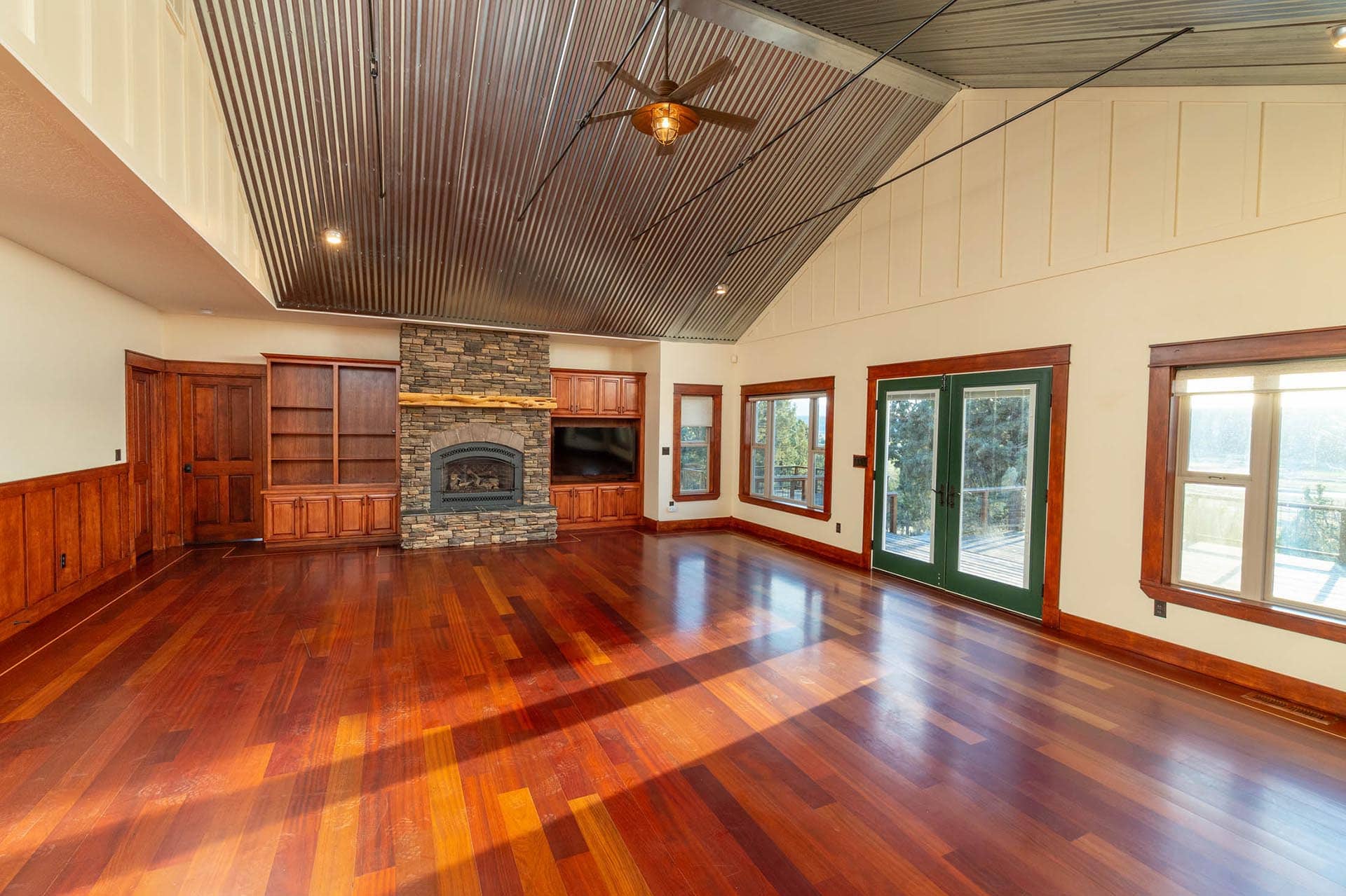 open concept great room with fireplace and wood floors oregon crooked river rim horse ranch
