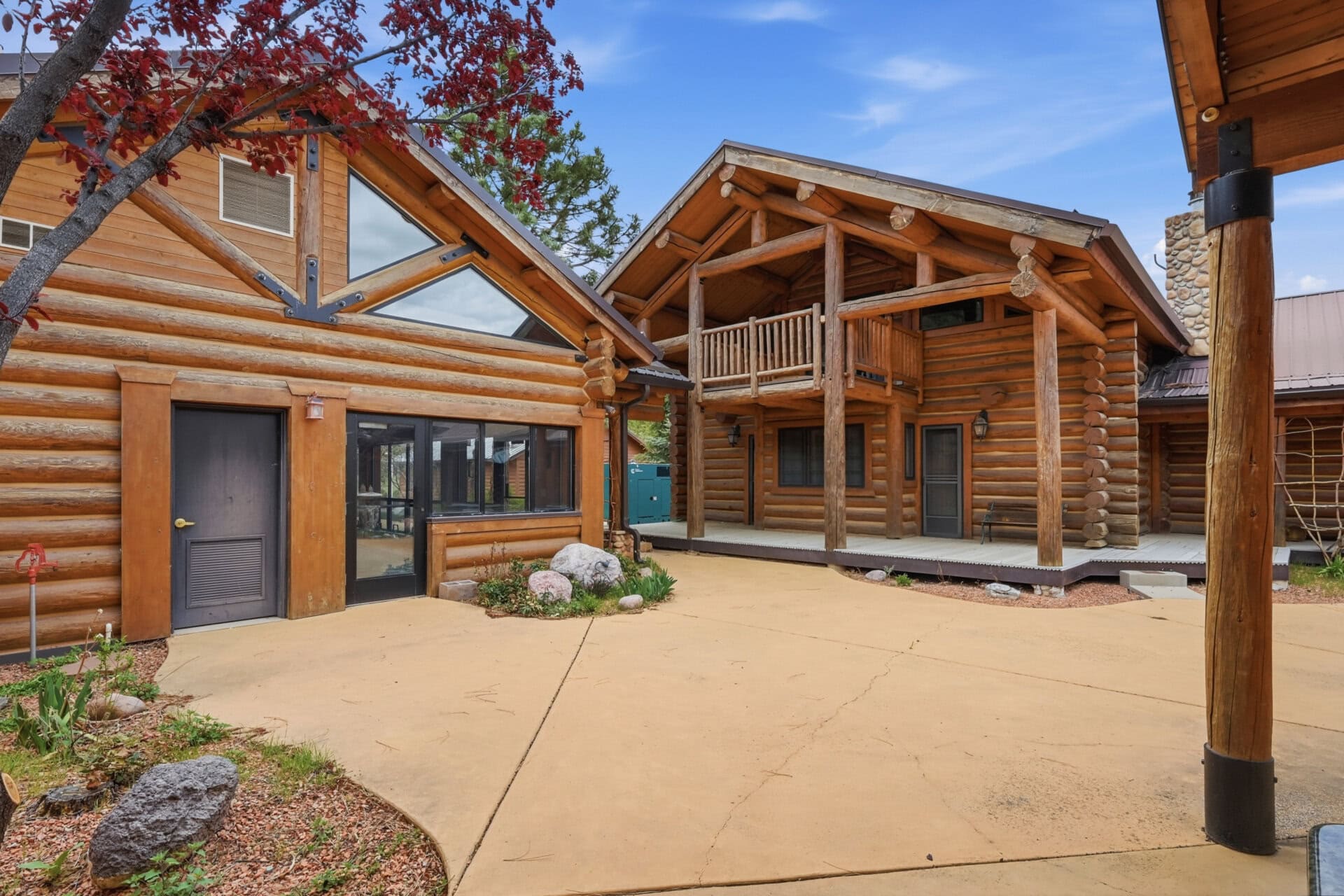 outdoor courtyard between log buildings utah casa del rio
