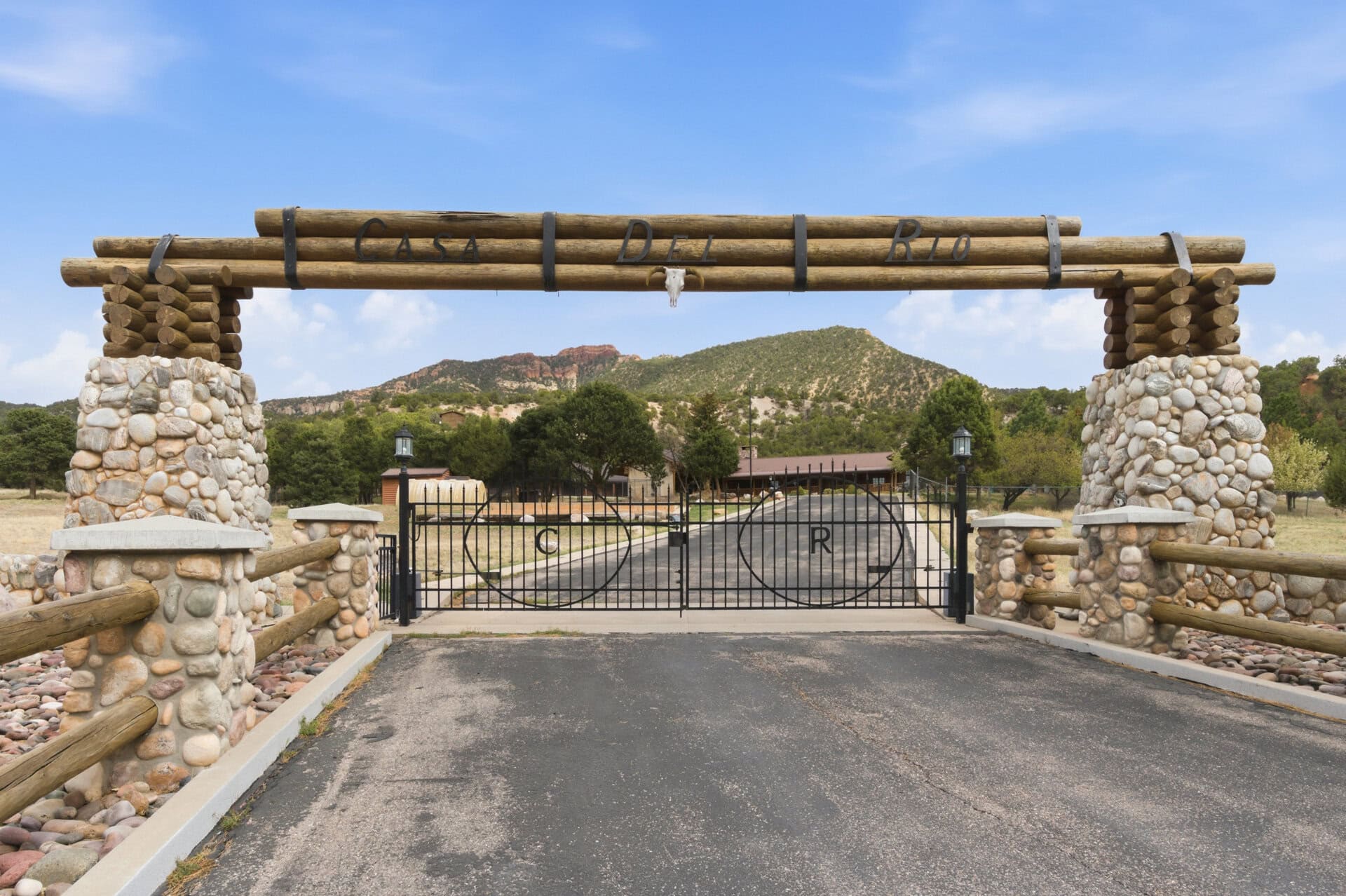 ranch entrance with log and stone gate utah casa del rio