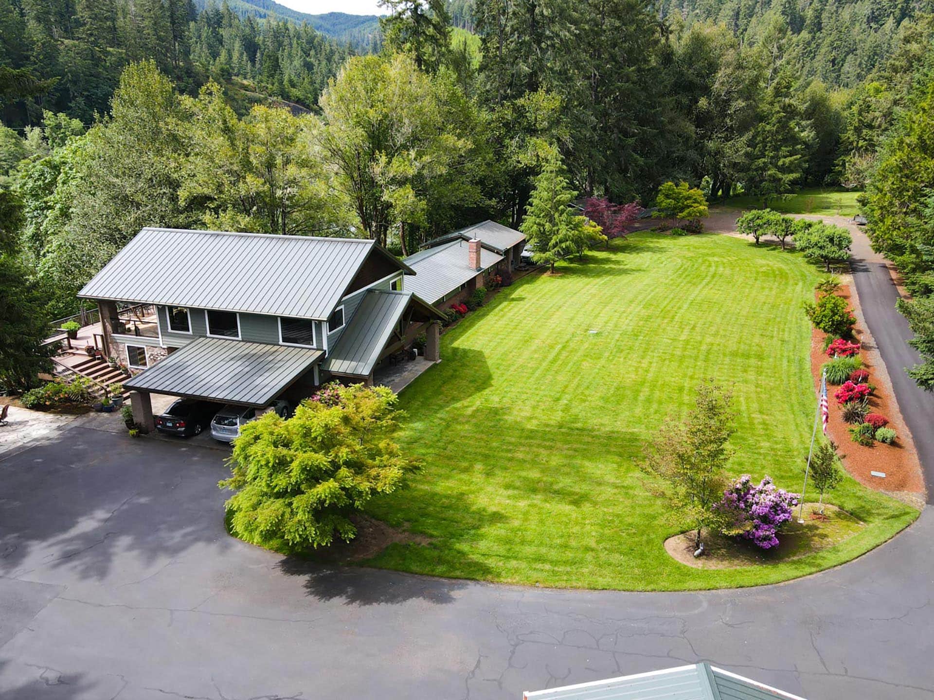 backyard lawn with river access and trees oregon umpqua river retreat at cougar creek