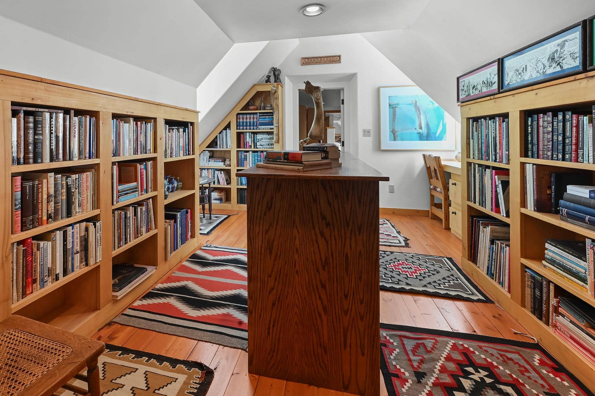 built in wooden bookshelves and southwestern rugs residential estate new mexico old canones creek ranch