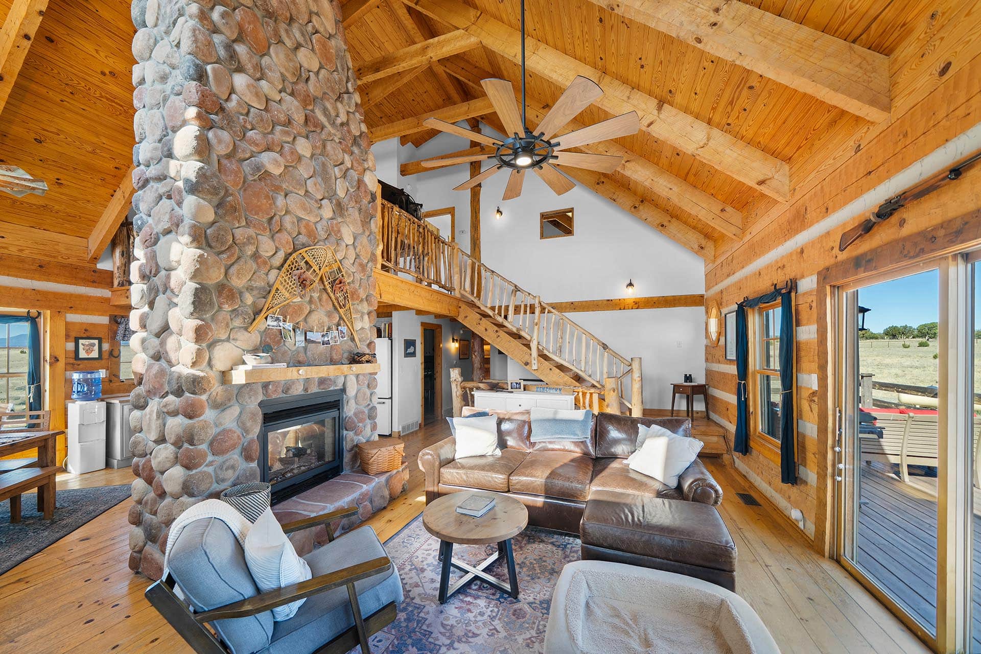 great room with vaulted wood ceiling colorado mchenry ranch