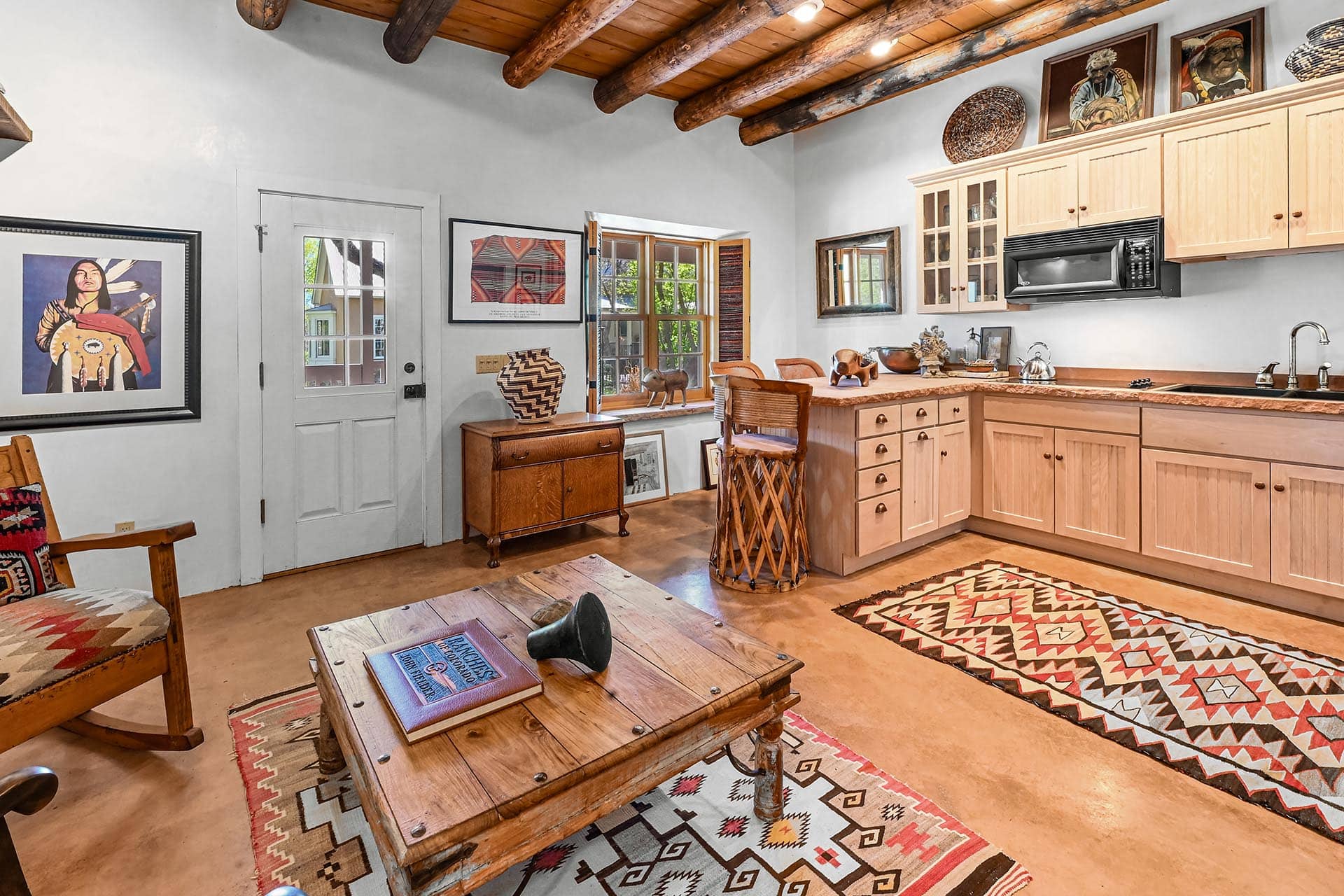kitchen and living area with vigas and southwestern decor residential estate property for sale new mexico old canones creek ranc