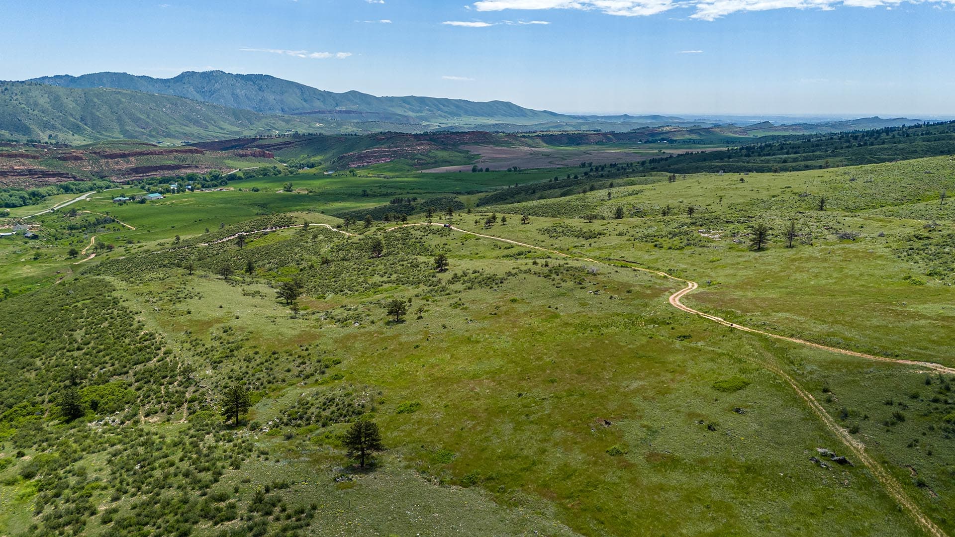 land with winding dirt road colorado bar d ranch