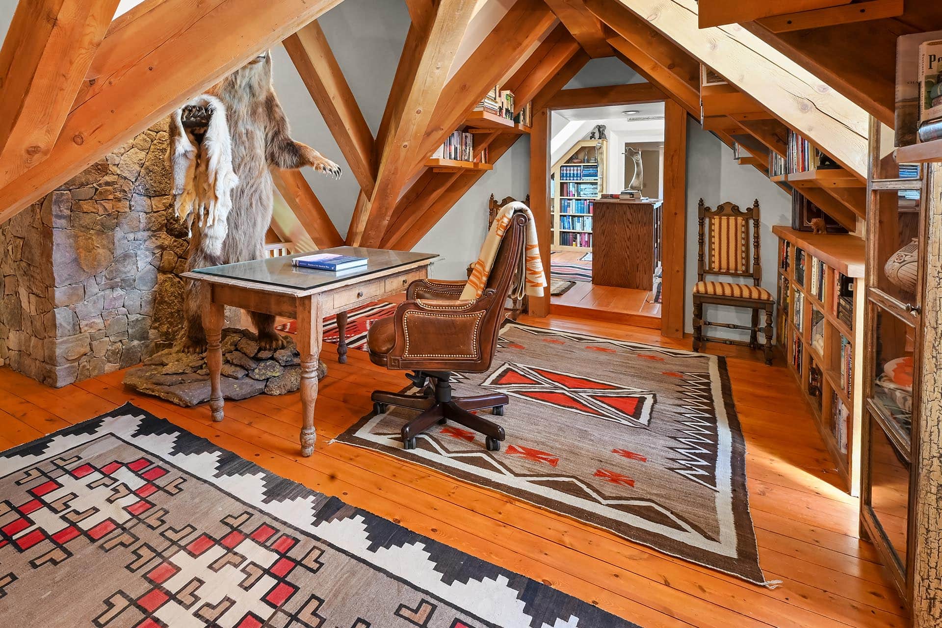 loft office with exposed beams and bear taxidermy residential estate new mexico old canones creek ranch