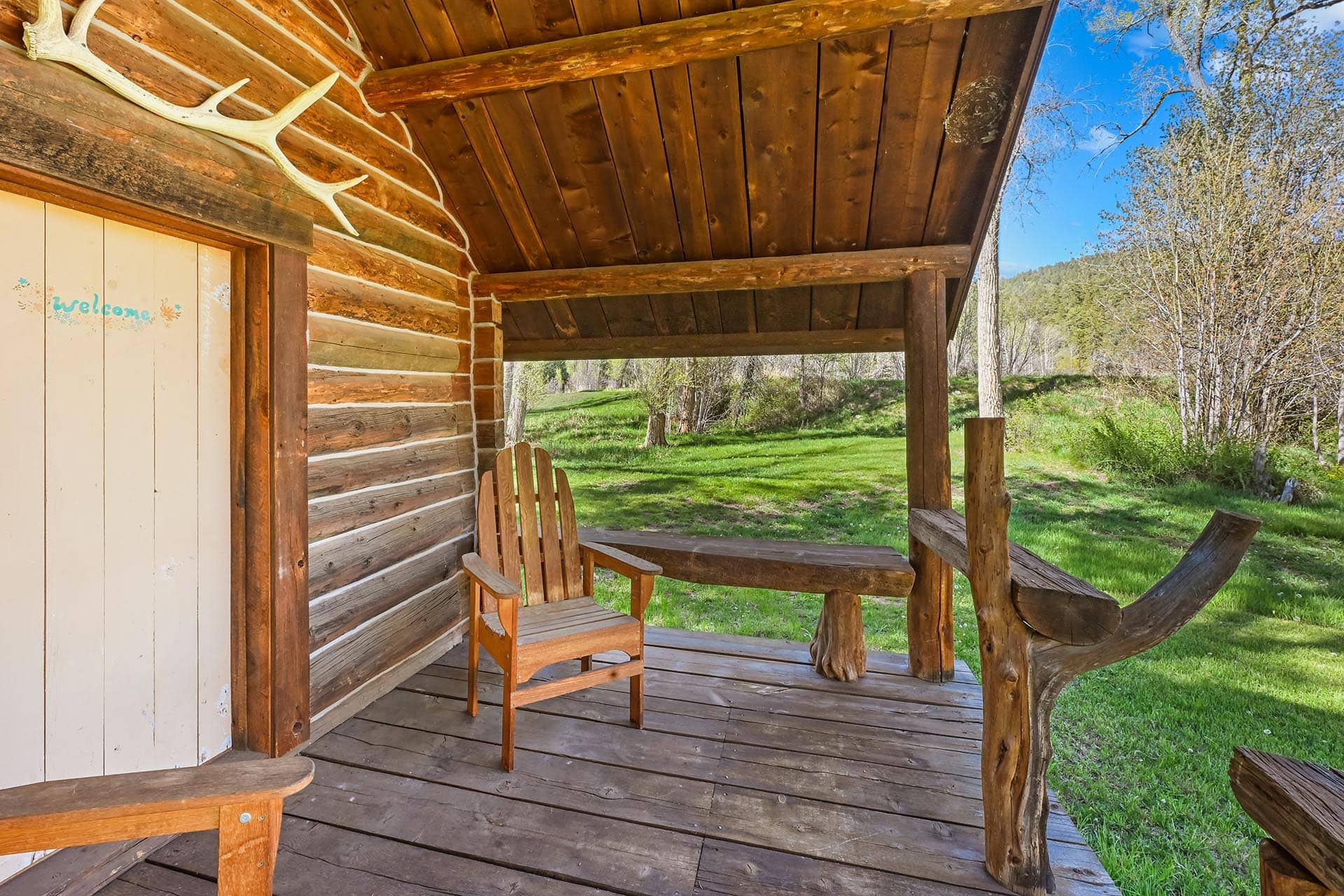 log cabin covered porch 44 75 acres for sale new mexico old canones creek ranch