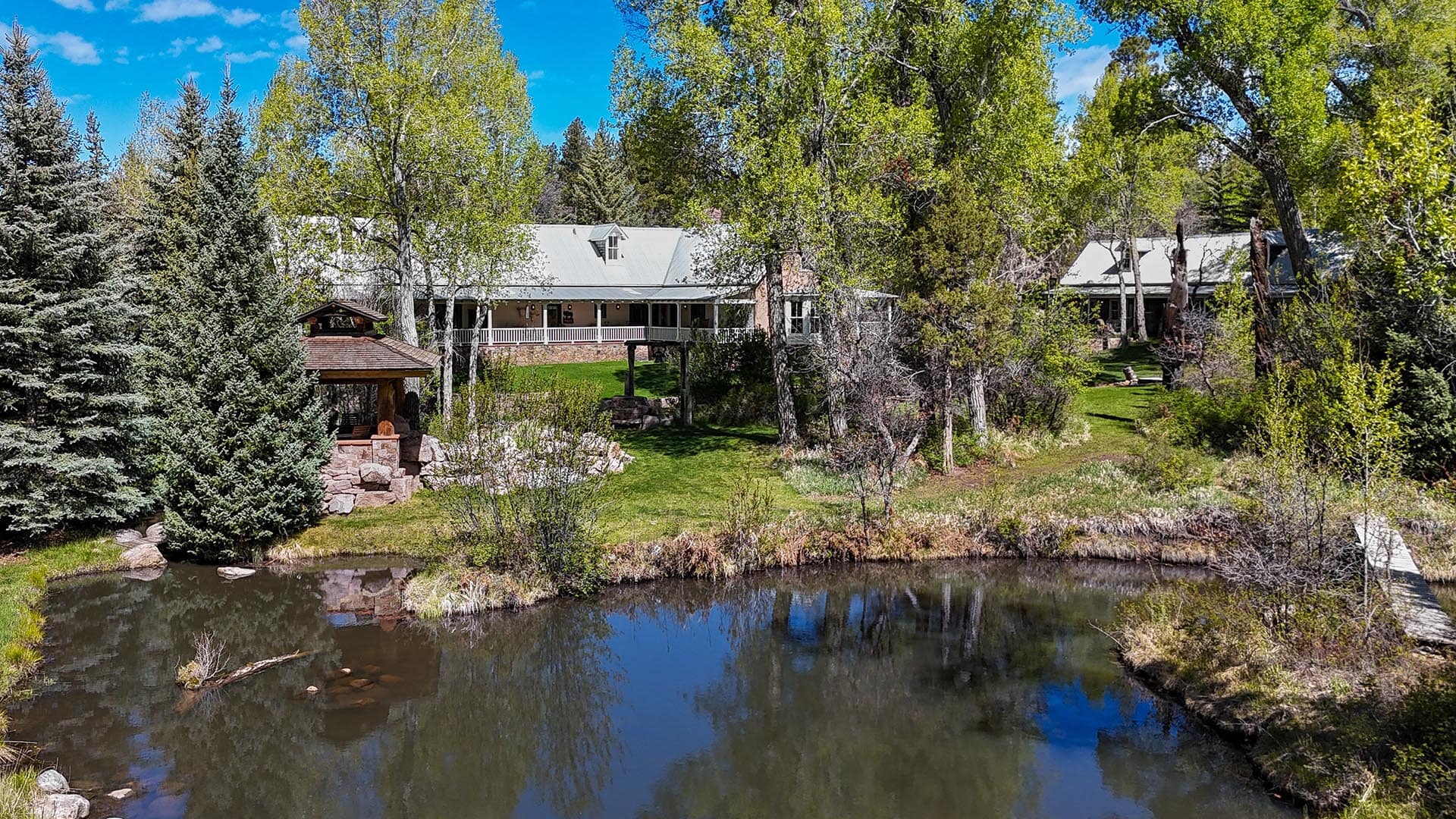 luxury homes for sale with main house pond and covered porch new mexico old canones creek ranch