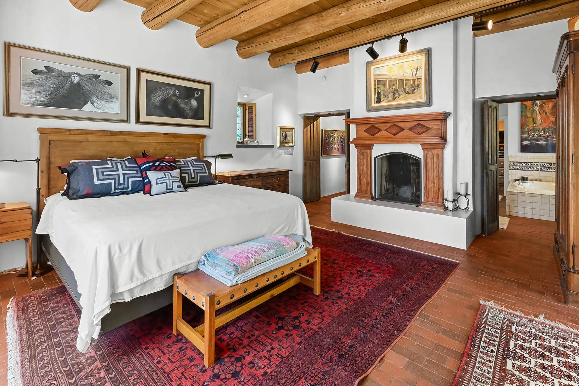 master bedroom with fireplace and vigas residential estate new mexico old canones creek ranch