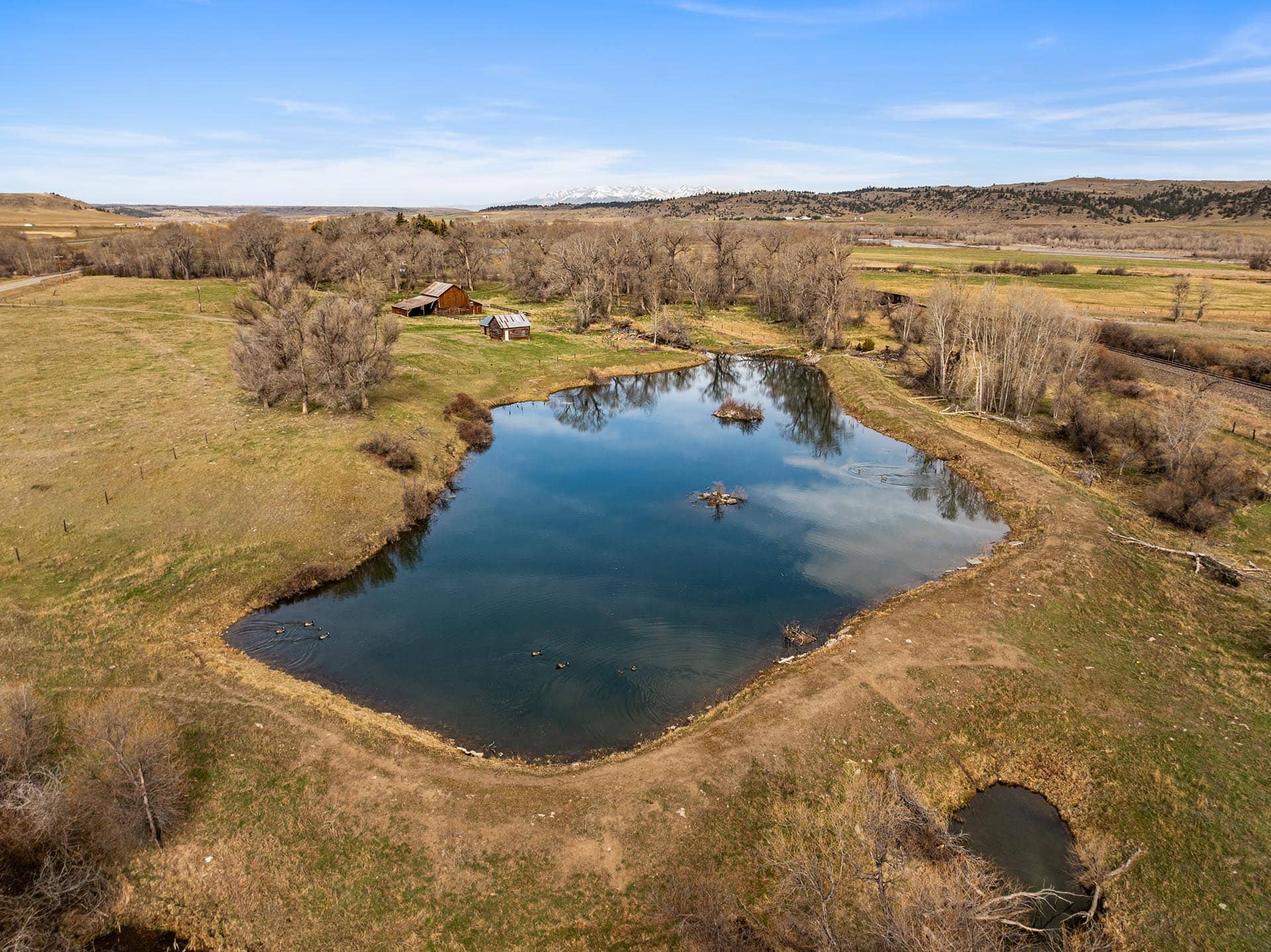 pond land for sale with historic barns montana mallard springs ranch