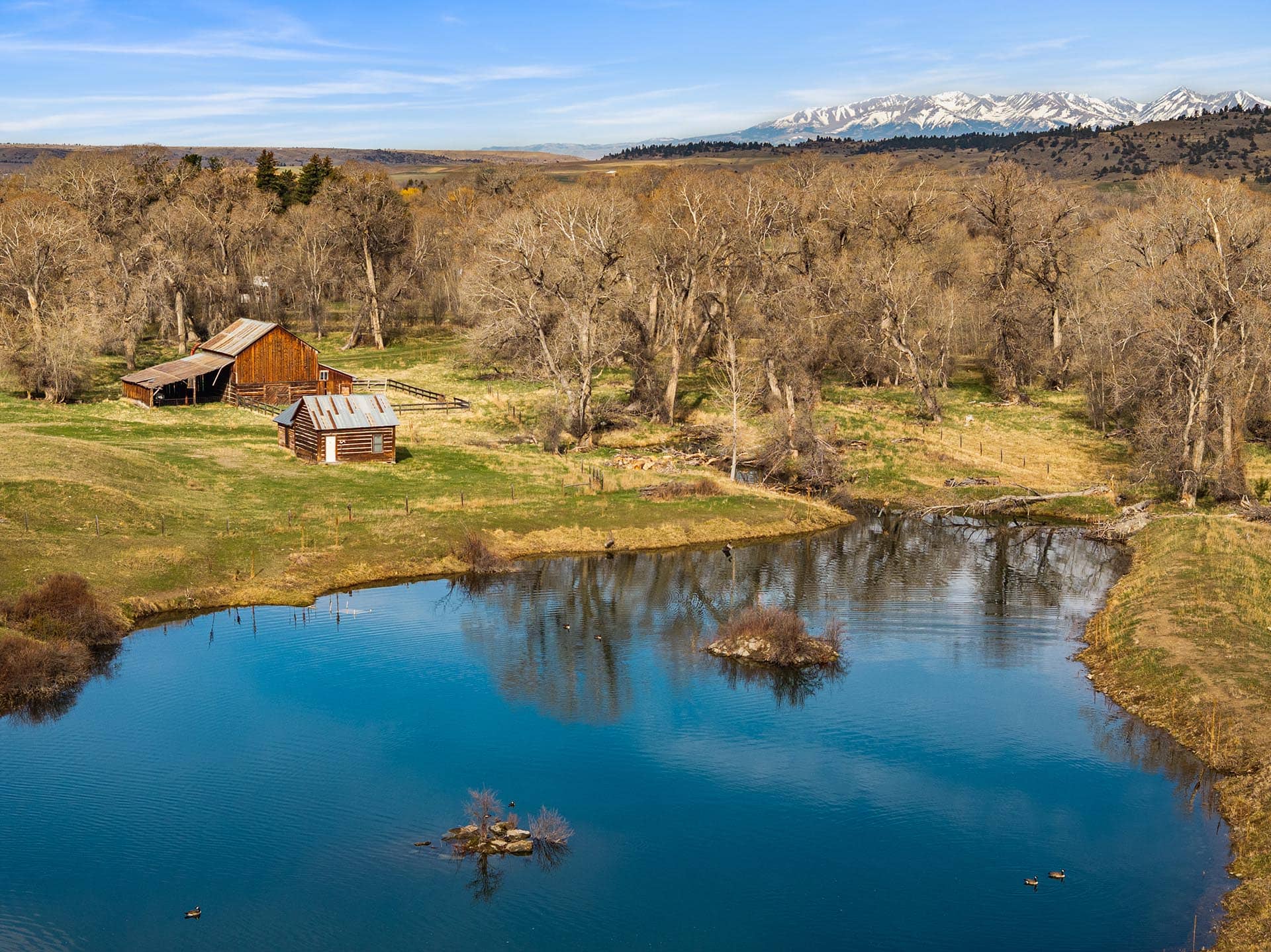 pond with barn and log cabin for sale montana mallard springs ranch