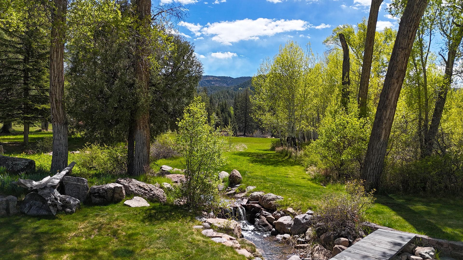 residential estate for sale with green meadow and small stream new mexico old canones creek ranch