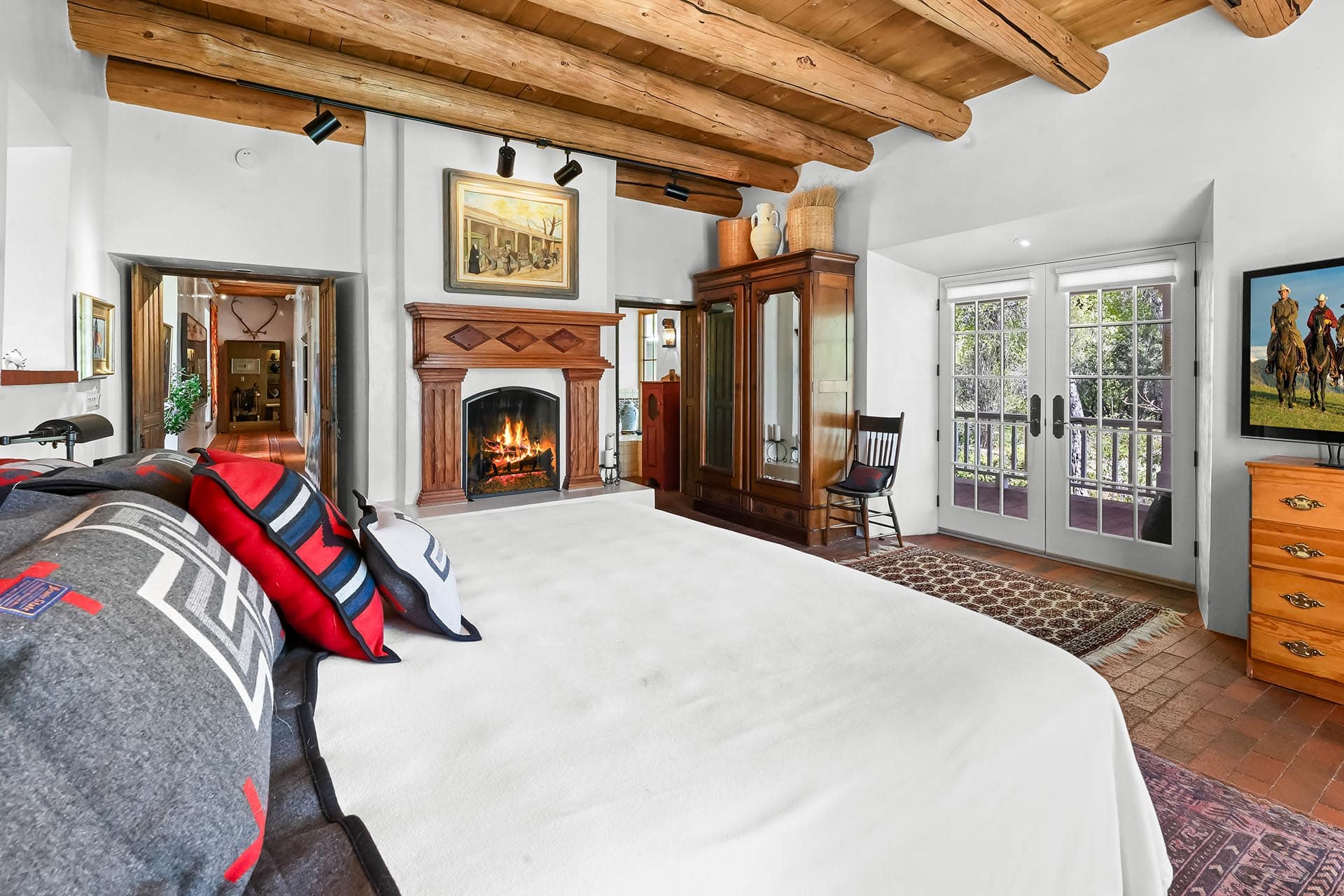 residential estate property for sale with exposed log beams and french doors new mexico old canones creek ranch
