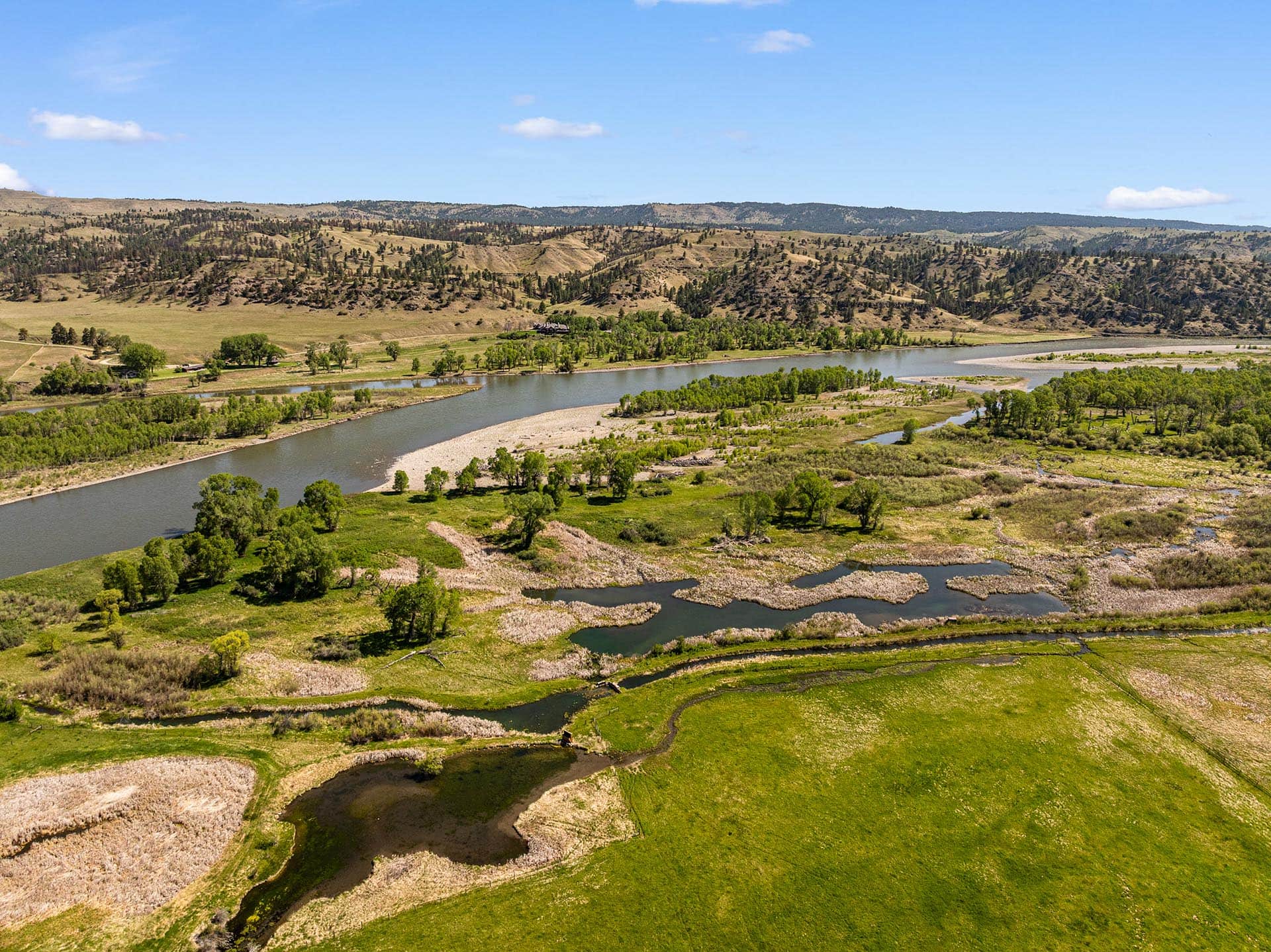 river and marshland for sale with green fields montana mallard springs ranch