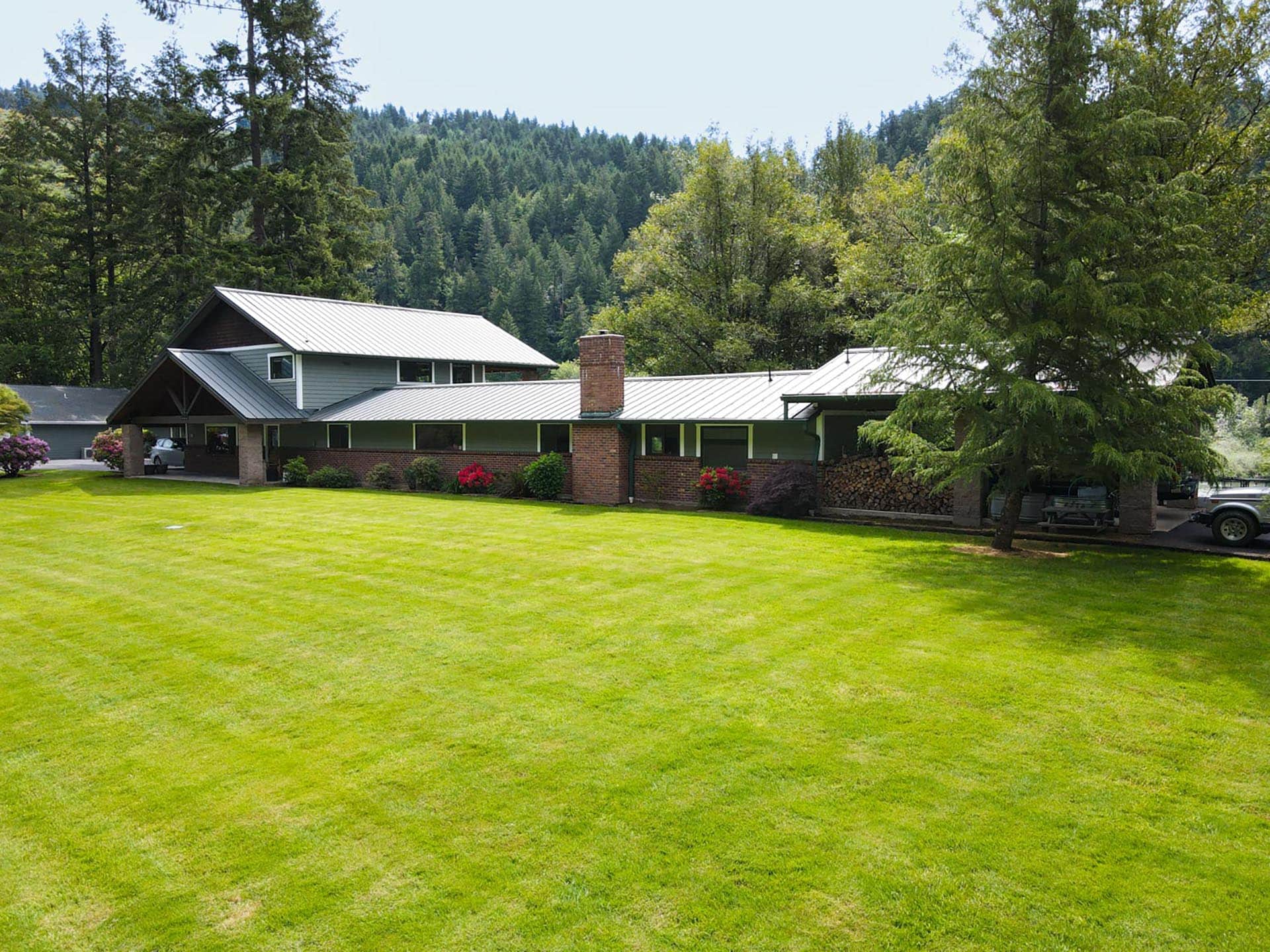 riverfront home exterior with large yard oregon umpqua river retreat at cougar creek