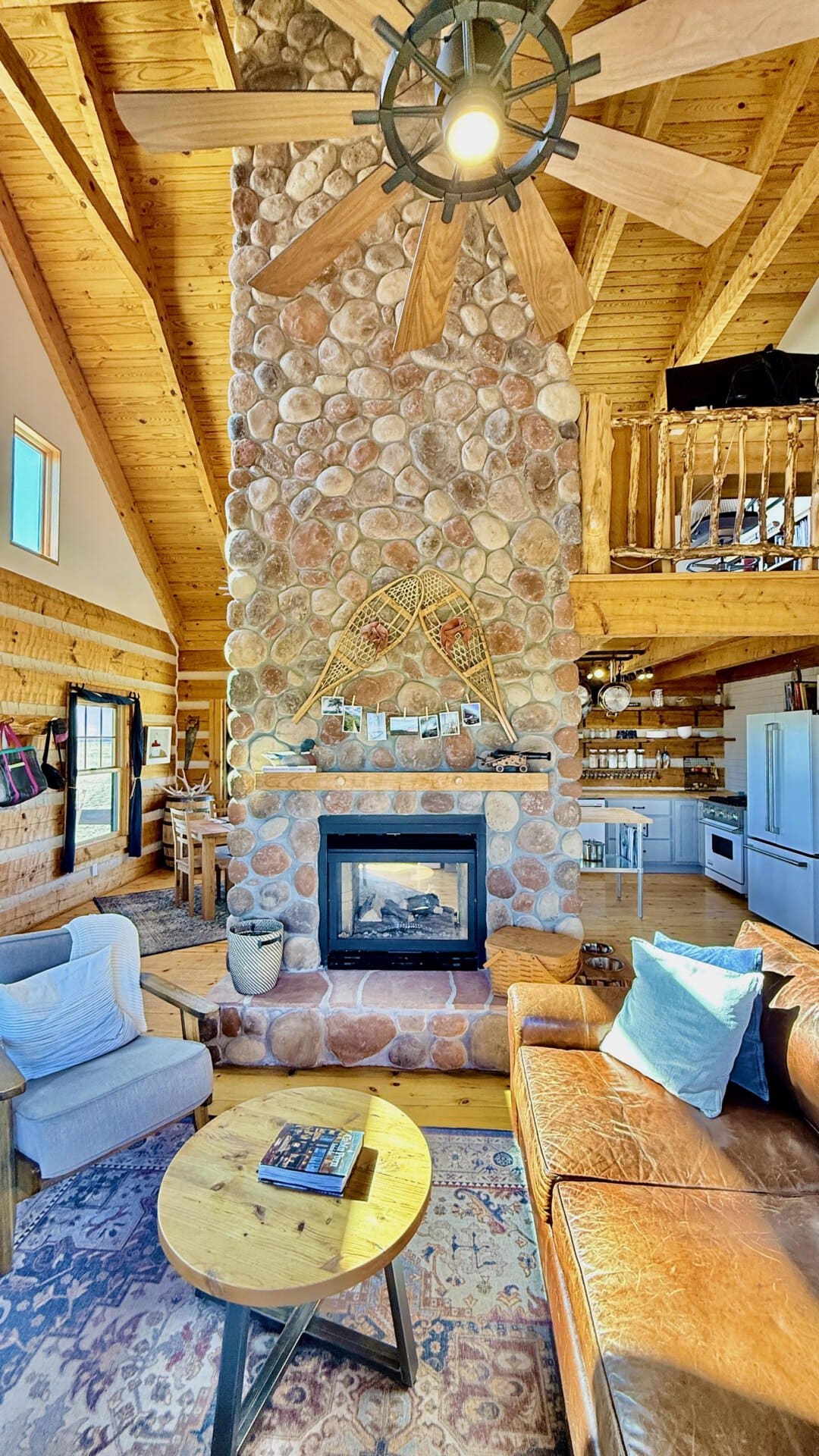 rustic home with large stone fireplace colorado mchenry ranch