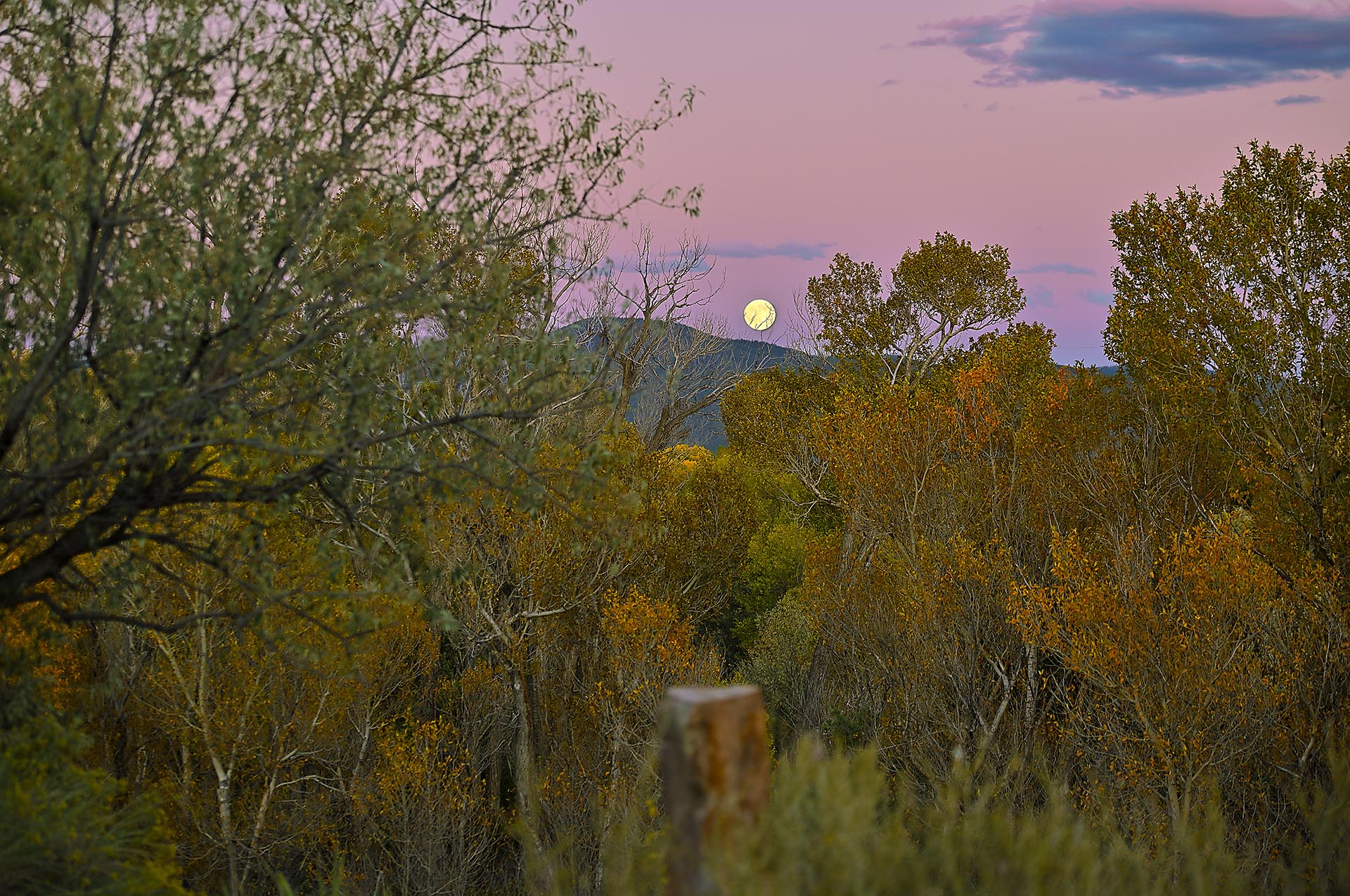 taos moonrise new mexico dos rios