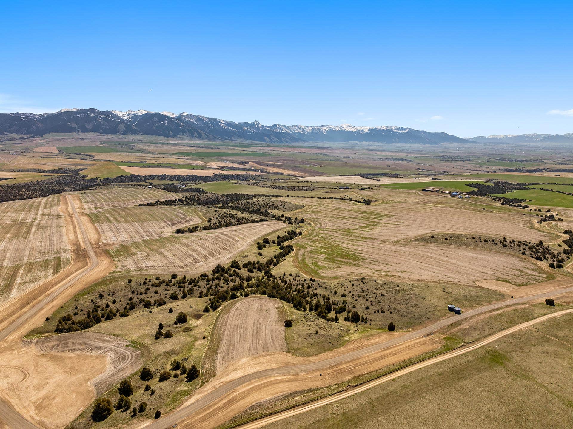 tilled farmland with mountain views montana skinner sanctuary at sxs ranch