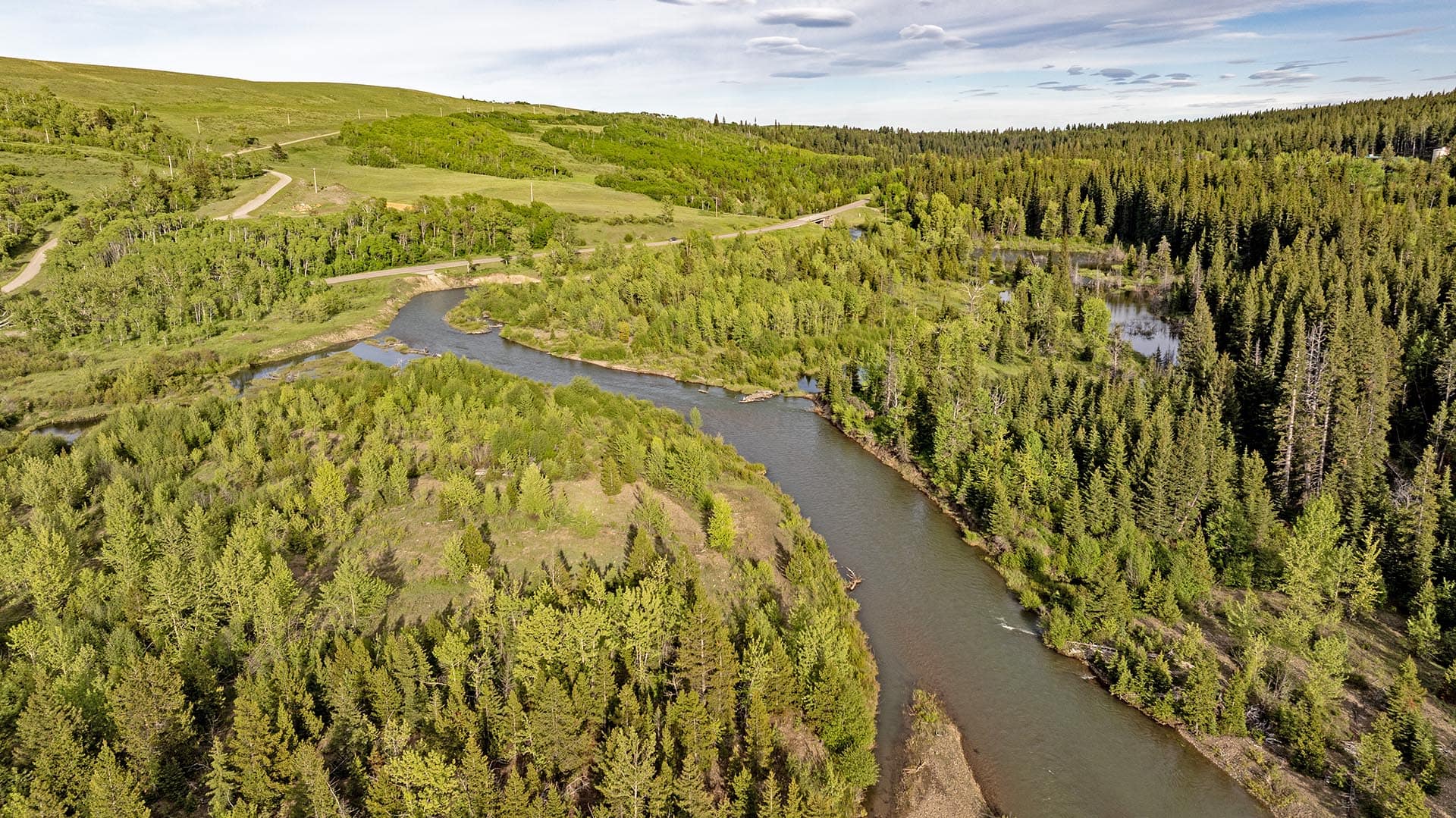 aerial view river frontage timber land for sale montana two medicine legacy ranch