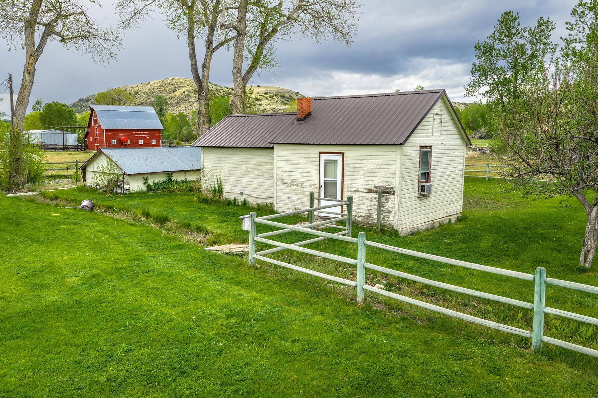 country home red barn green pasture land montana stillwater riffle ranch