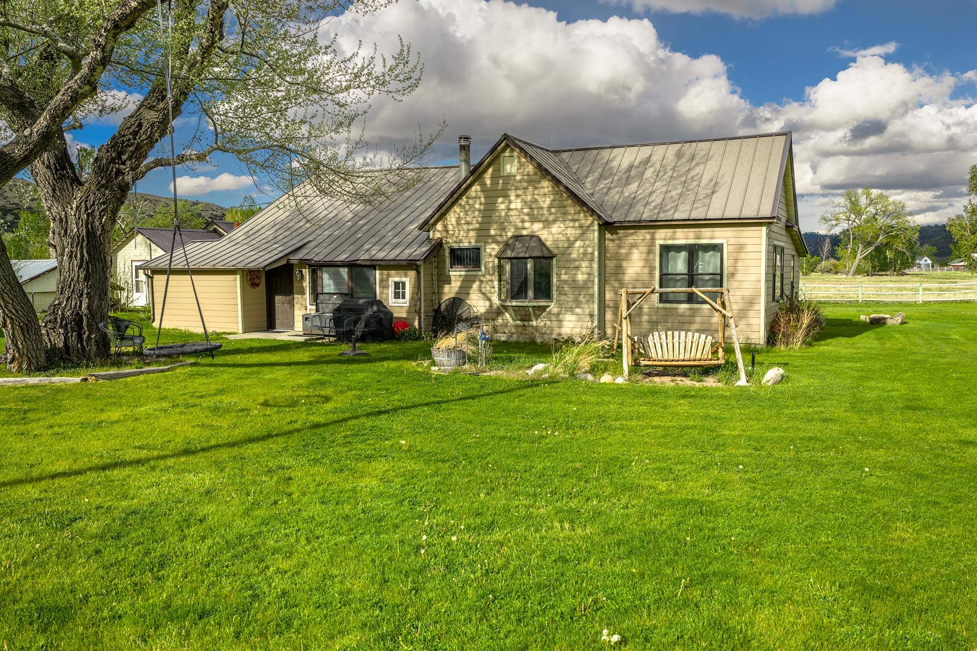 country home with porch swing and tire swing montana stillwater riffle ranch