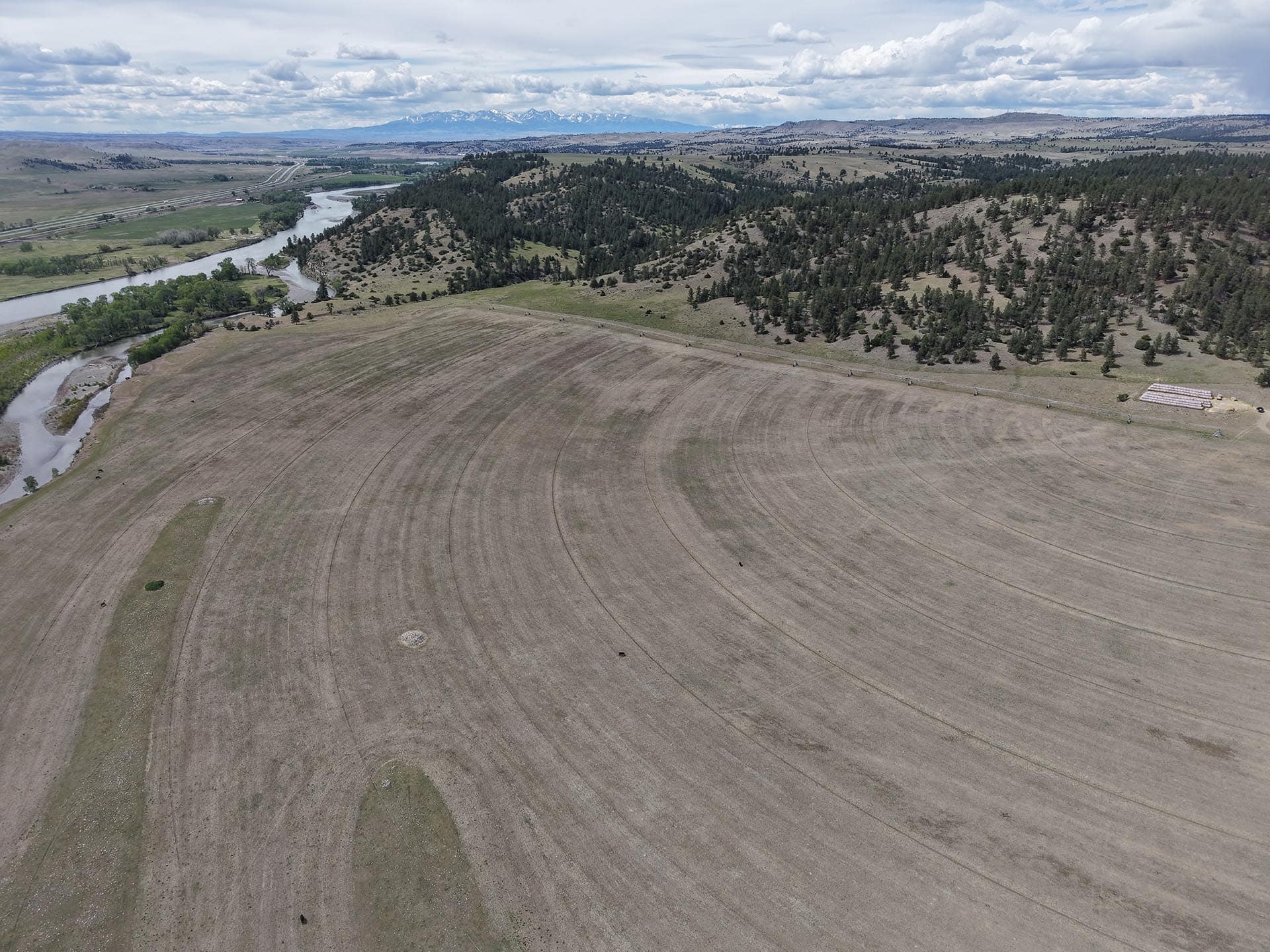 irrigated field with hay bales for sale montana springtime ranch on the yellowstone river