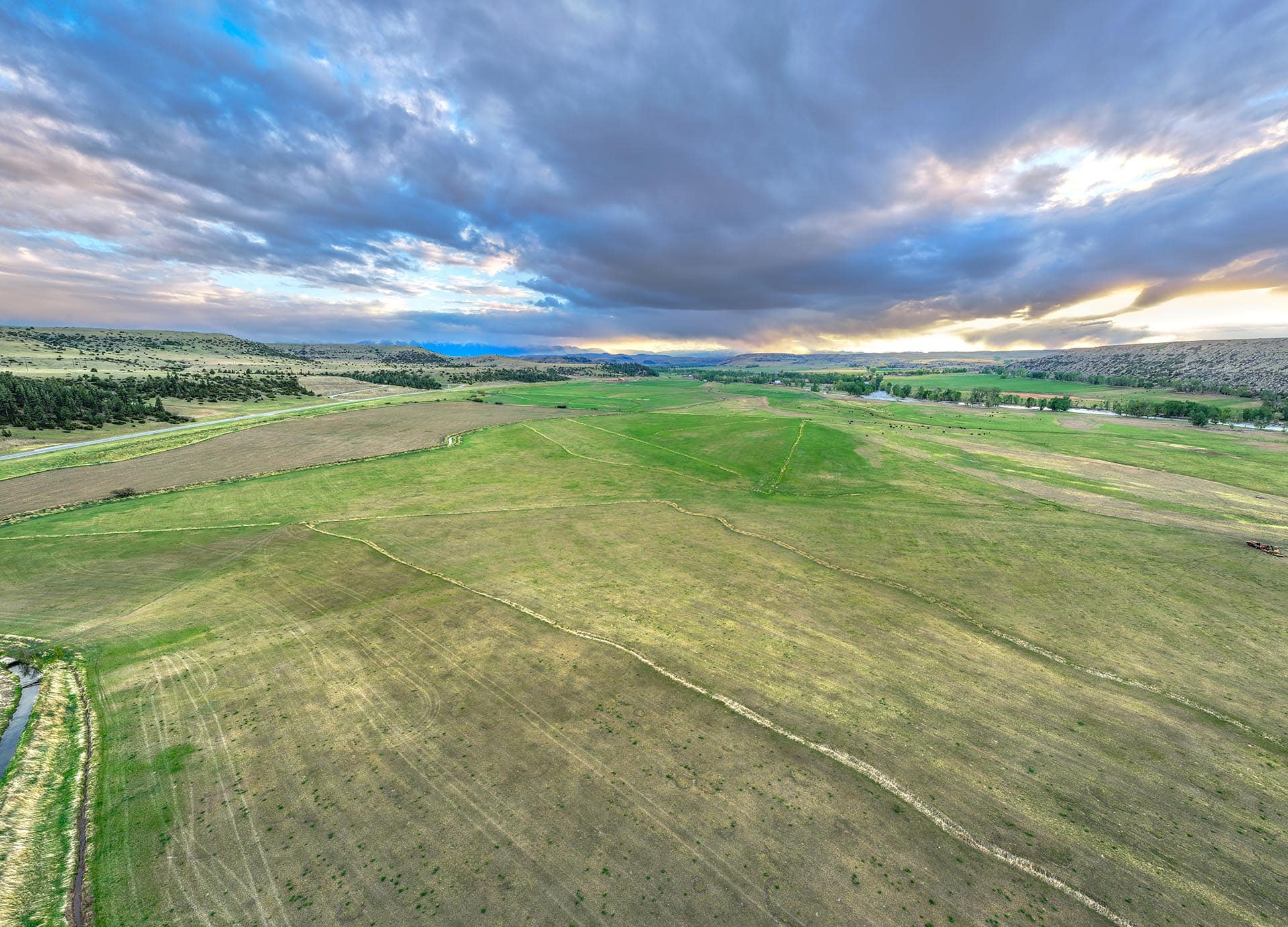 large acreage for sale with mountain views and green fields montanan stillwater riffle ranch