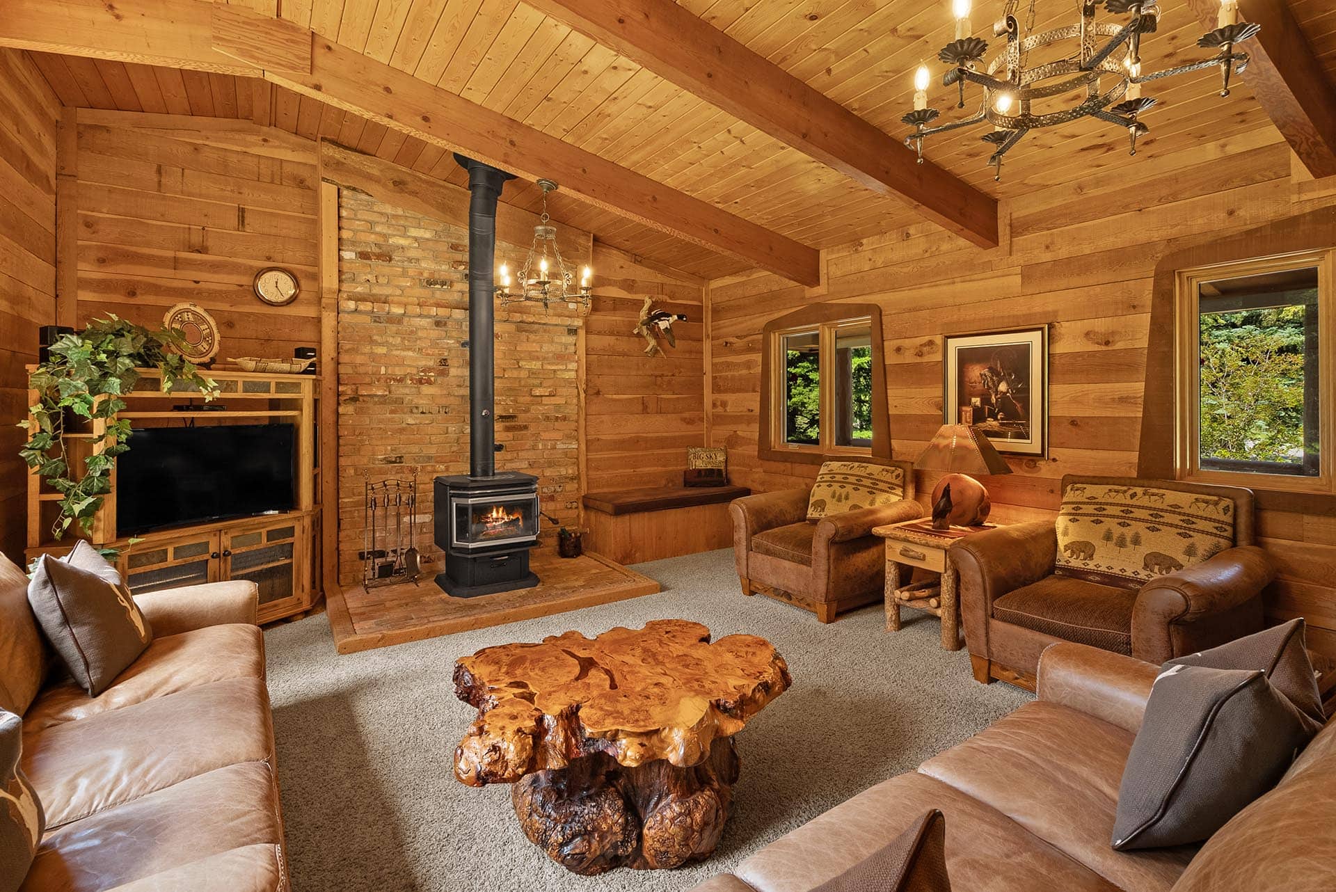 living room with wood burning stove montana gallatin riverfront retreat in big sky