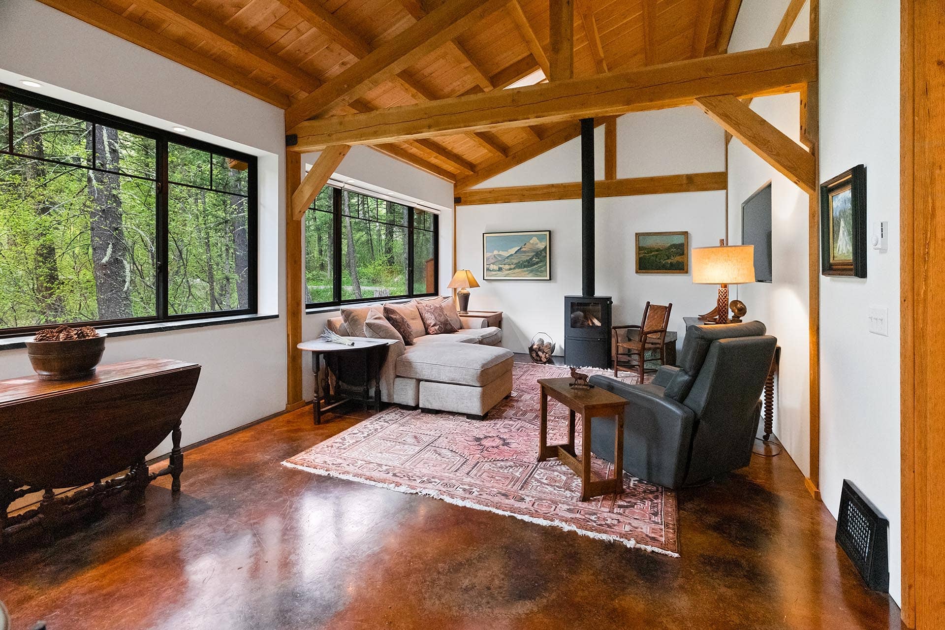 living room with wood stove home montana bozeman creekside hideaway