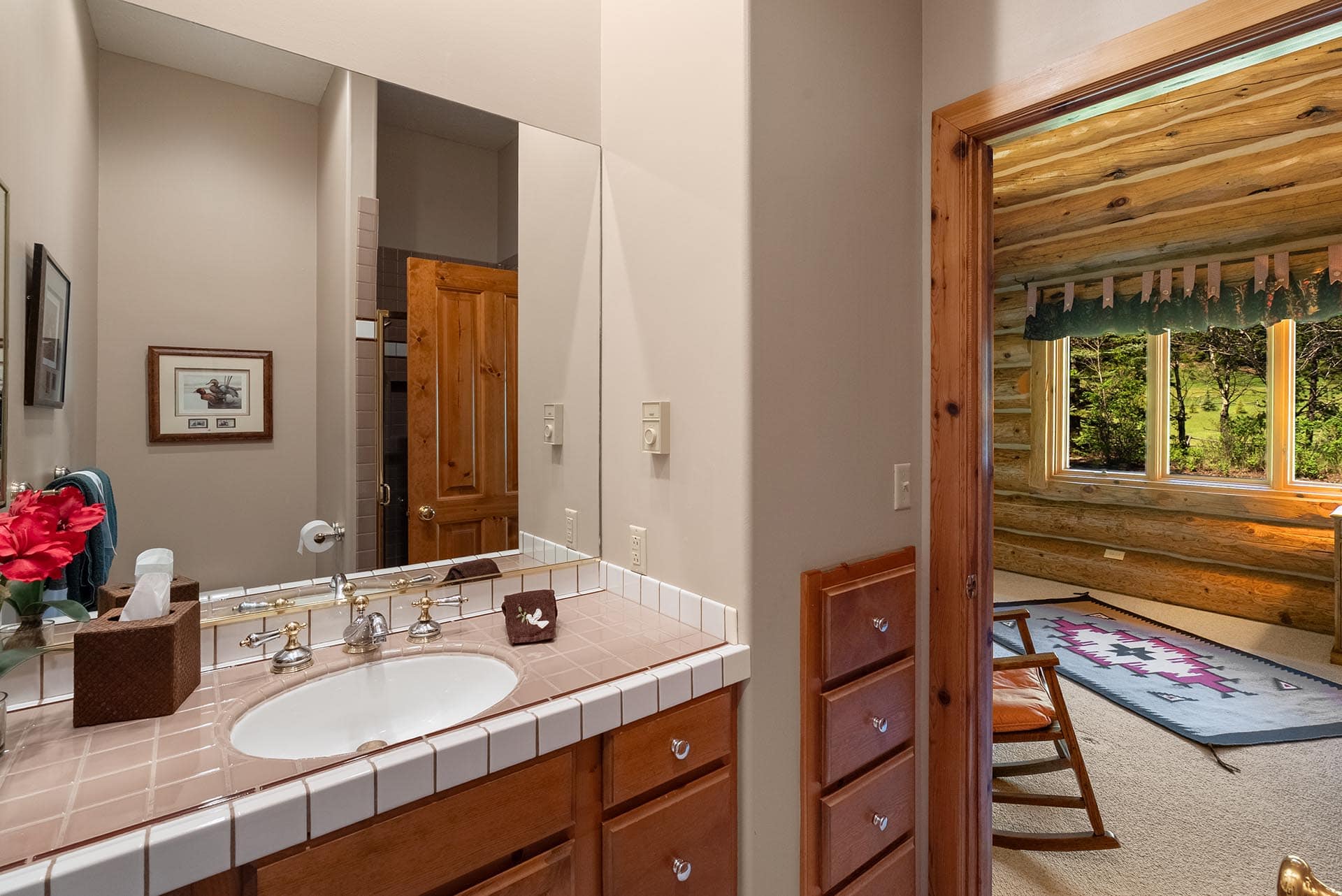 log home bathroom with vanity and wood accents montana gallatin riverfront retreat in big sky