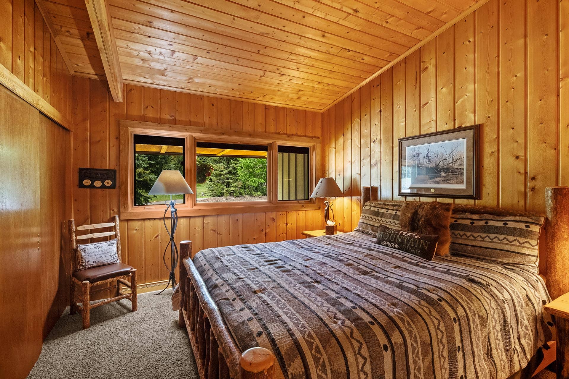 log home bedroom interior montana gallatin riverfront retreat in big sky