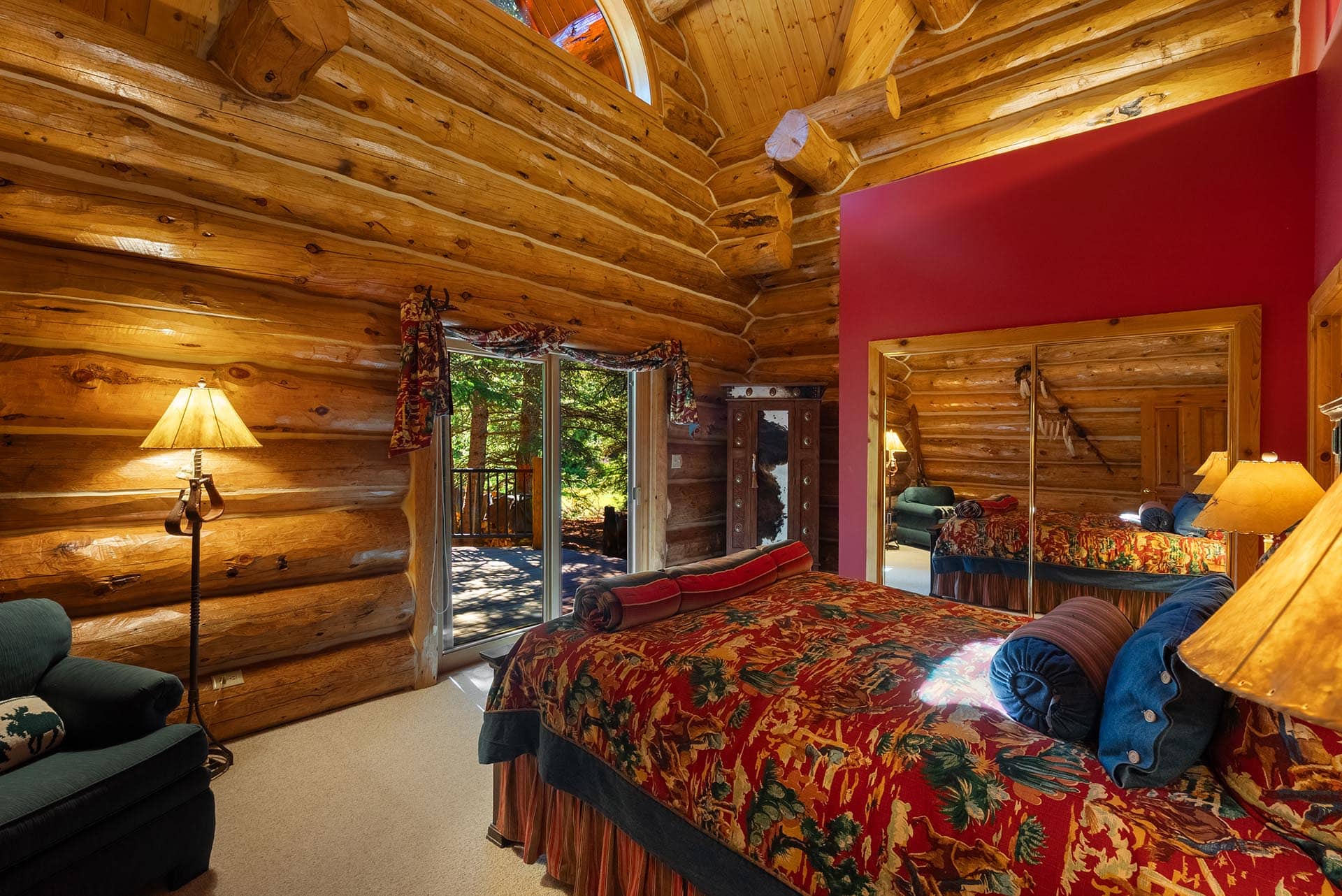 log home bedroom with balcony montana gallatin riverfront retreat in big sky