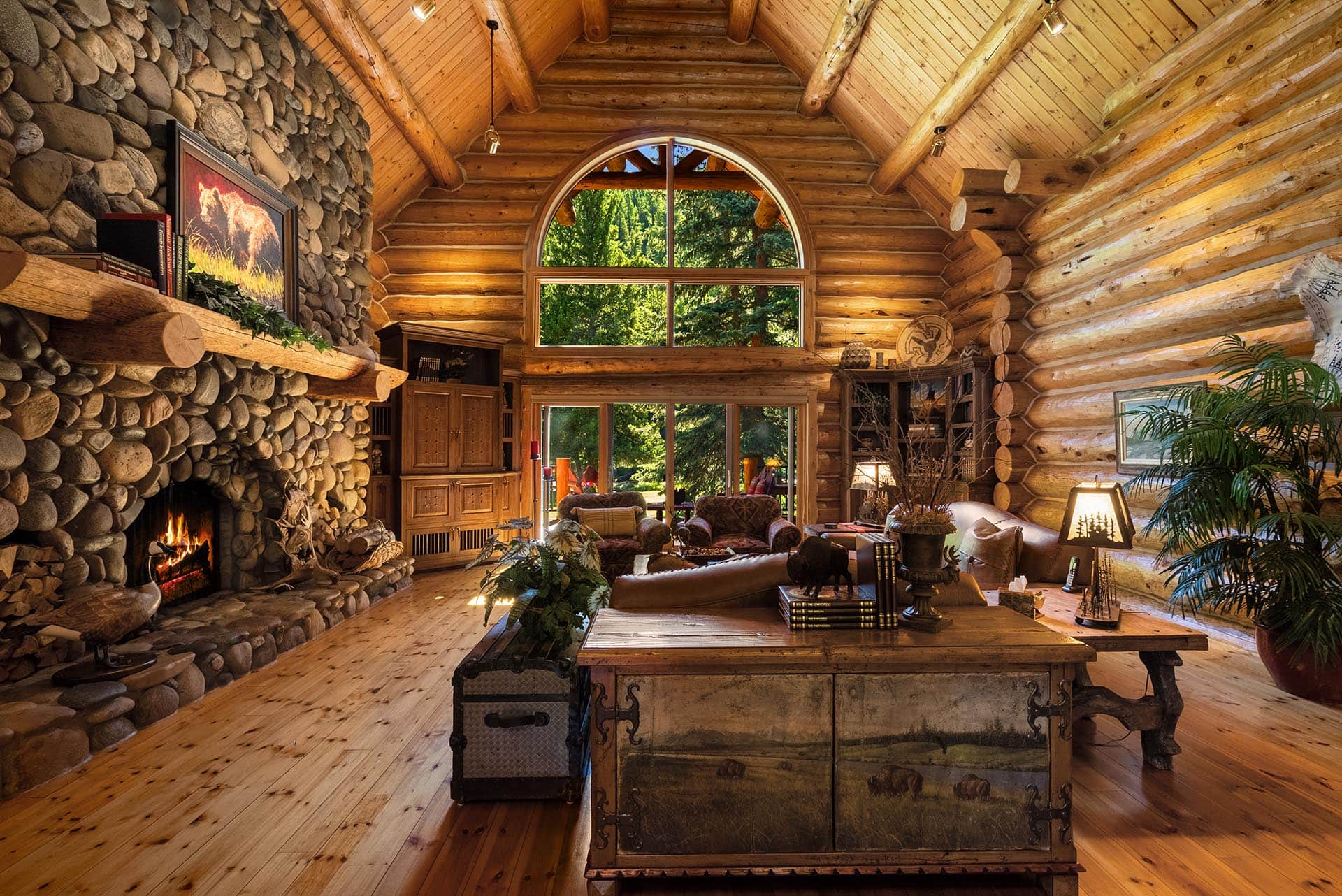 log home interior stone fireplace land for sale montana gallatin riverfront retreat in big sky