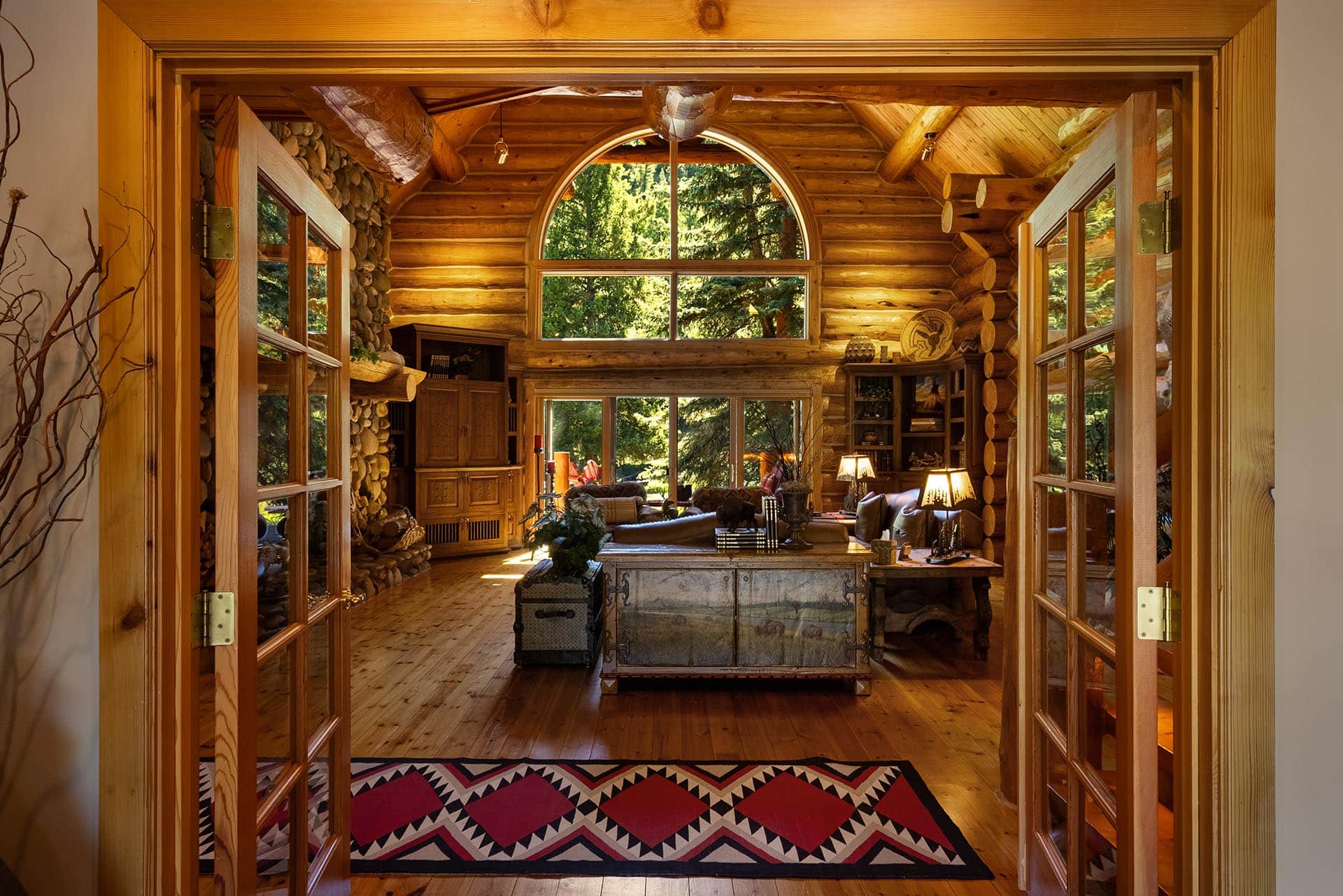 log home living area with forest views montana gallatin riverfront retreat in big sky
