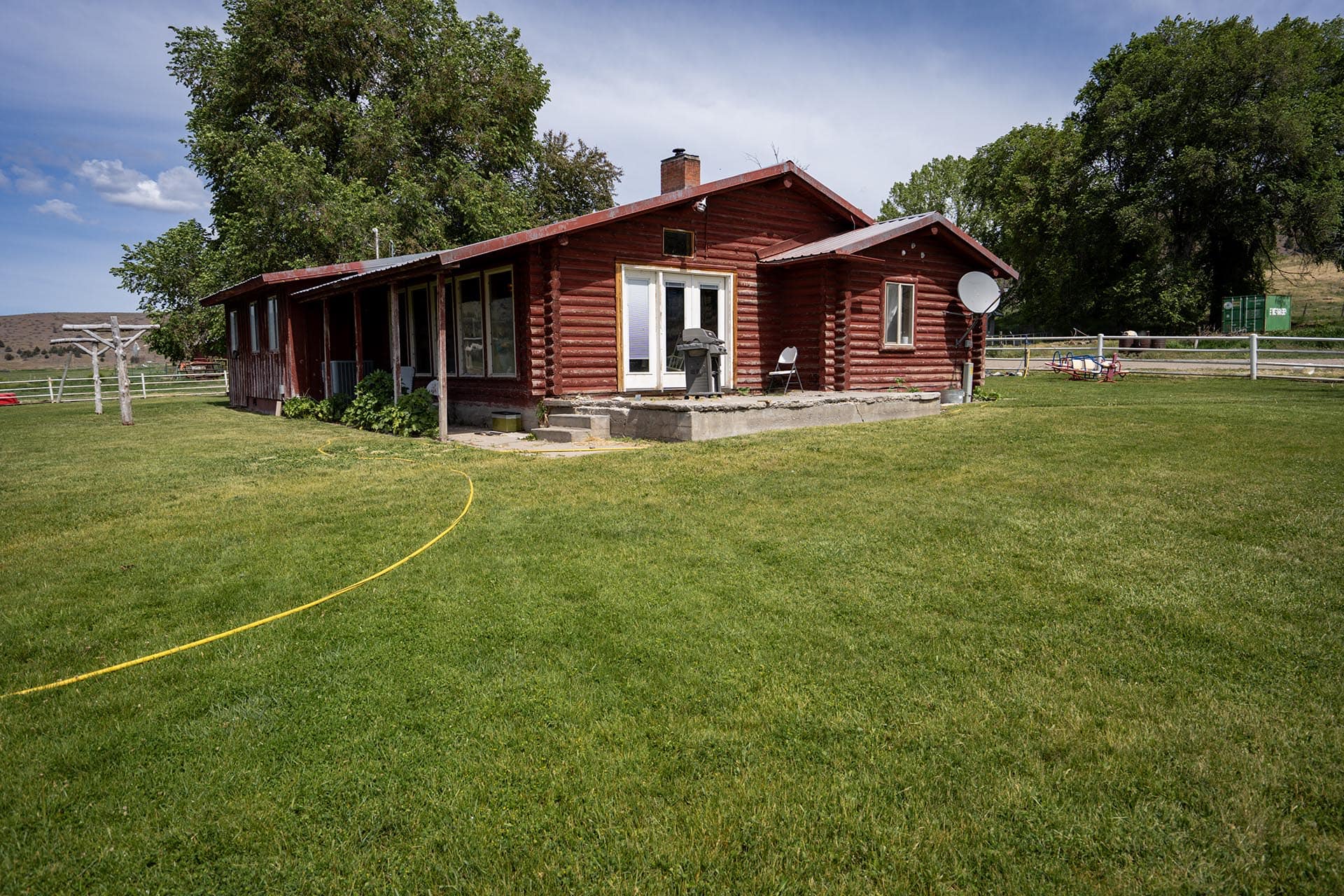 log style house with fenced lawn oregon ironside castle rock ranch