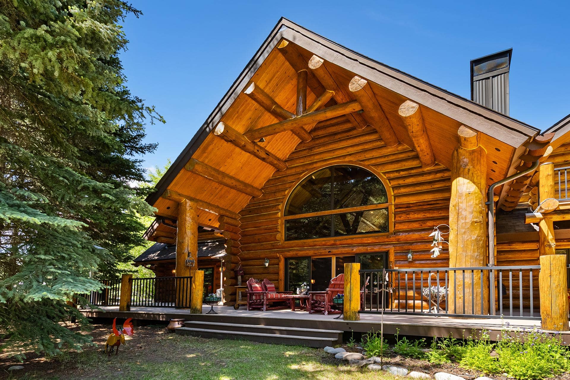luxury log home exterior with deck montana gallatin riverfront retreat in big sky